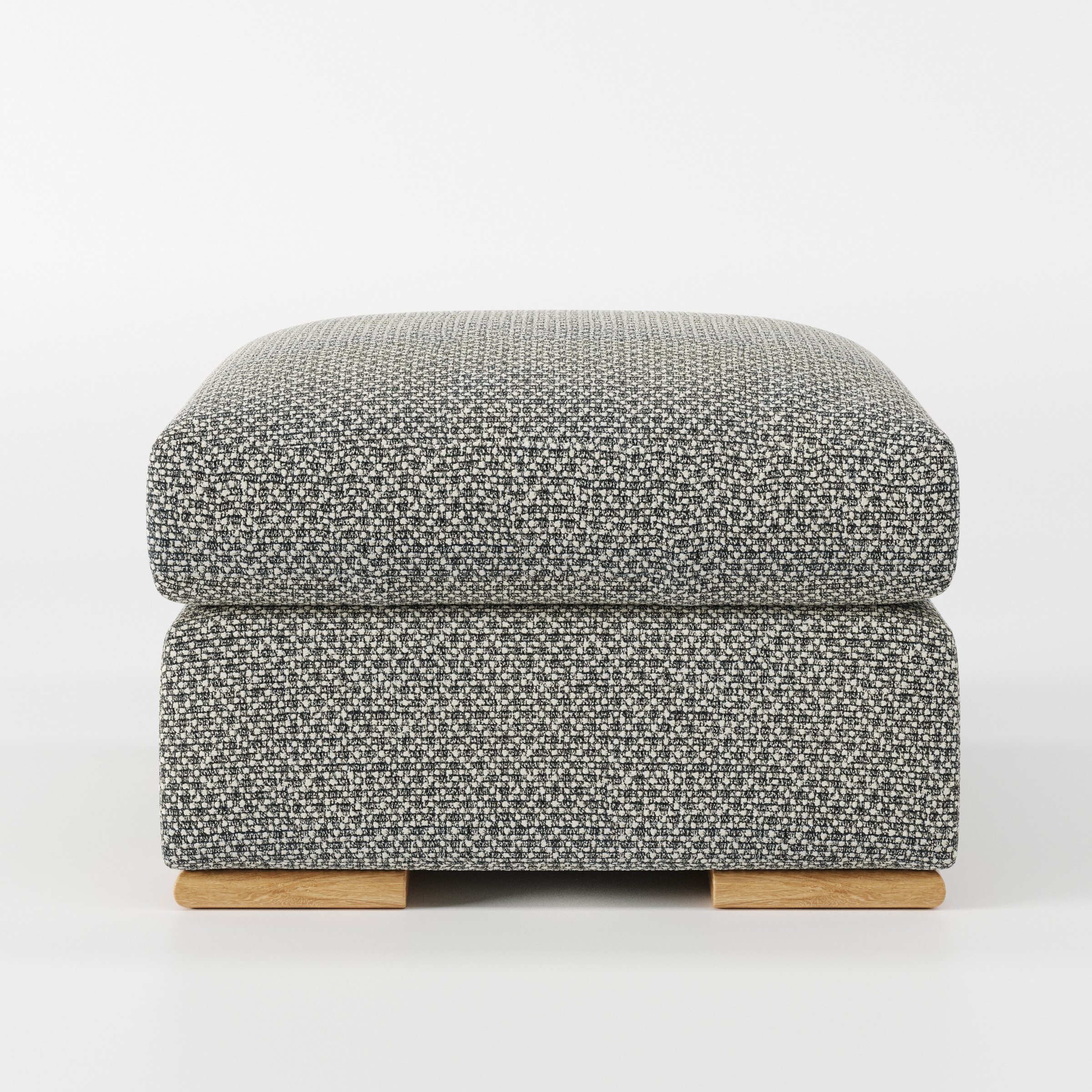 Moy footstool in Rousay Wool Blend Tar and Chalk shown front-on against a neutral studio backdrop.