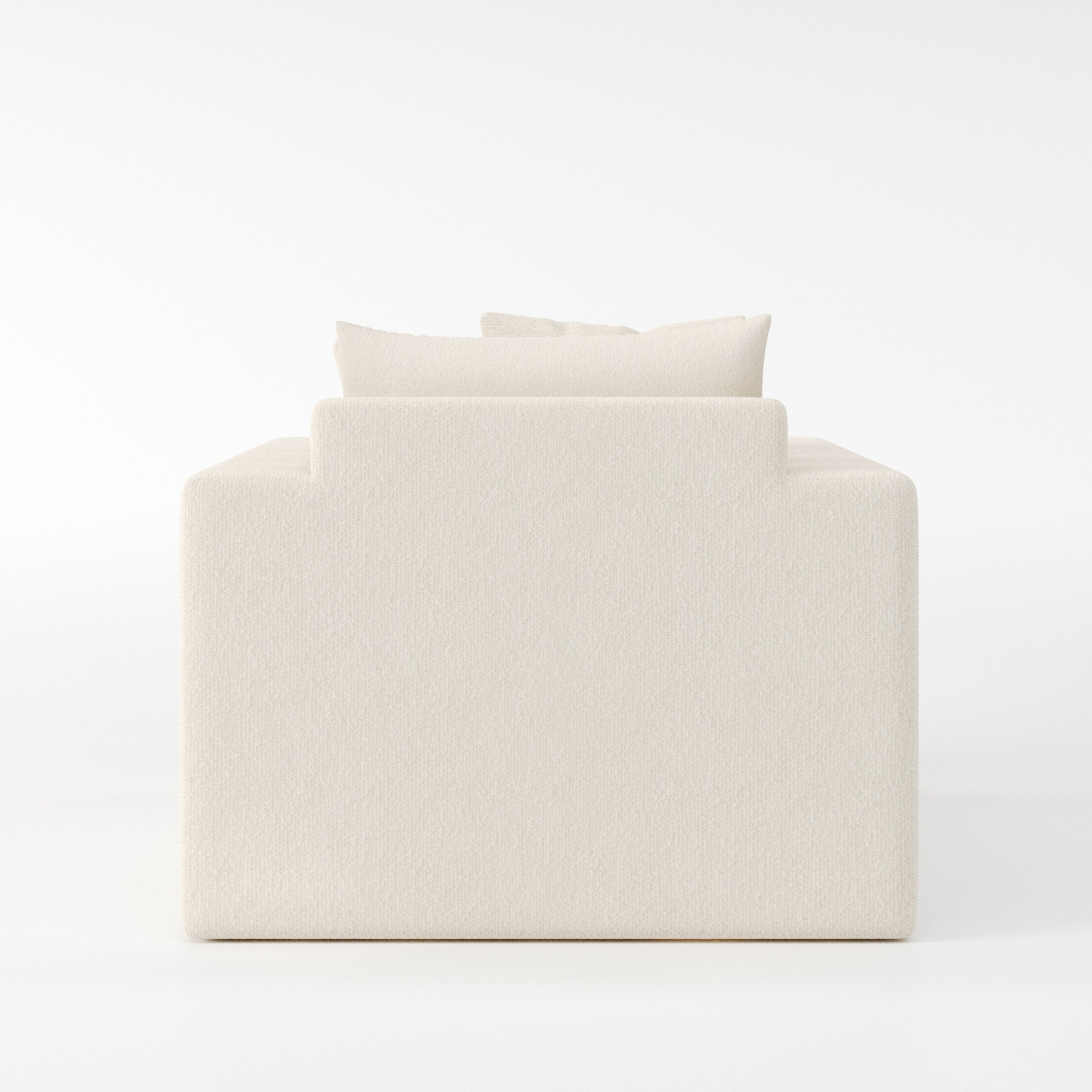 Coniston armchair in Kilda Boucle Cream shown from the rear highlighting backrest shape and upholstery finish.