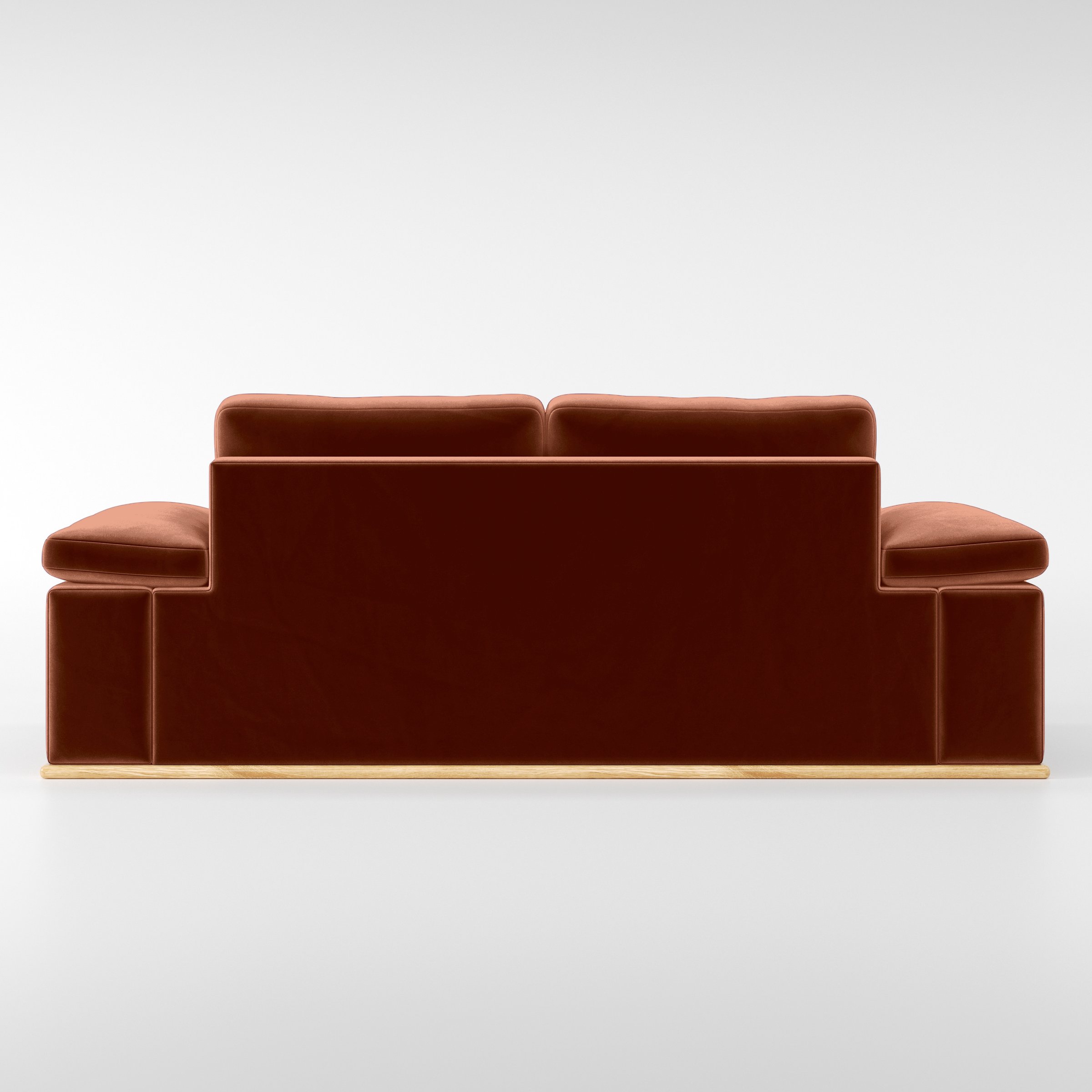 Rear view of the Cusher sofa upholstered in Plush EasyClean Velvet in Apricot.
