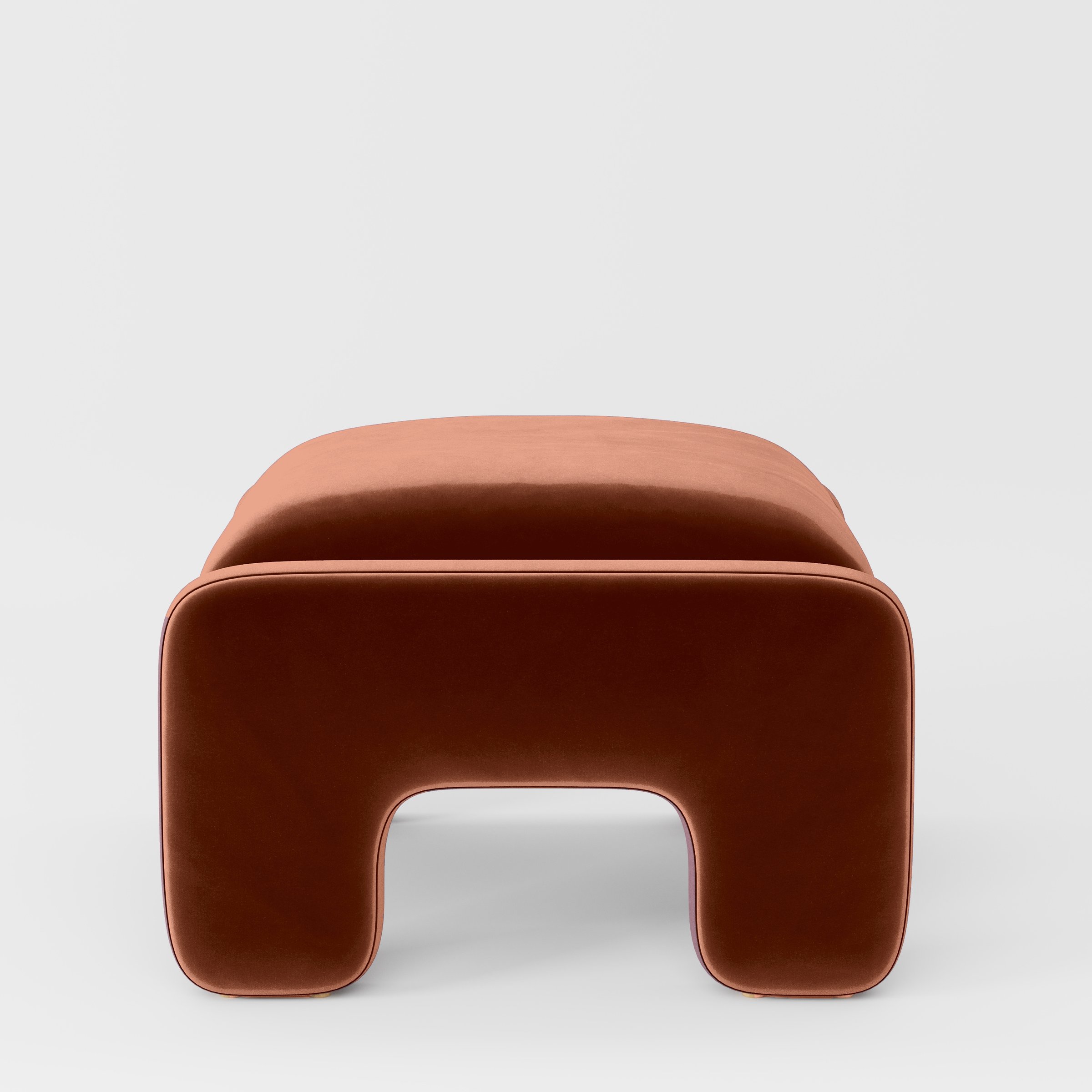 Side view of the Inny footstool upholstered in Plush EasyClean Velvet in Apricot.