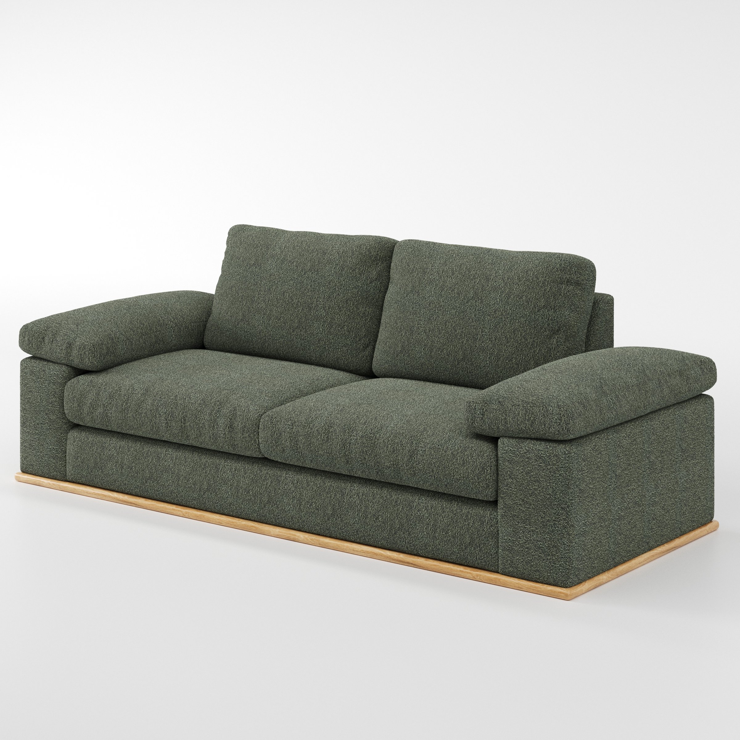 Cusher sofa in Kilda Boucle Moss shown at a diagonal angle highlighting arm profile and seat depth.