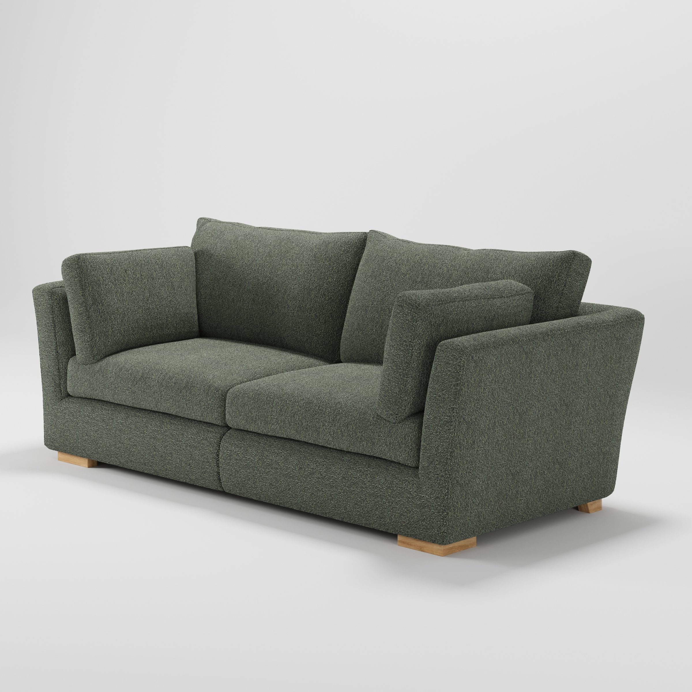 Stowe sofa in Kilda Boucle Moss shown at a diagonal angle highlighting arm profile and seat depth.