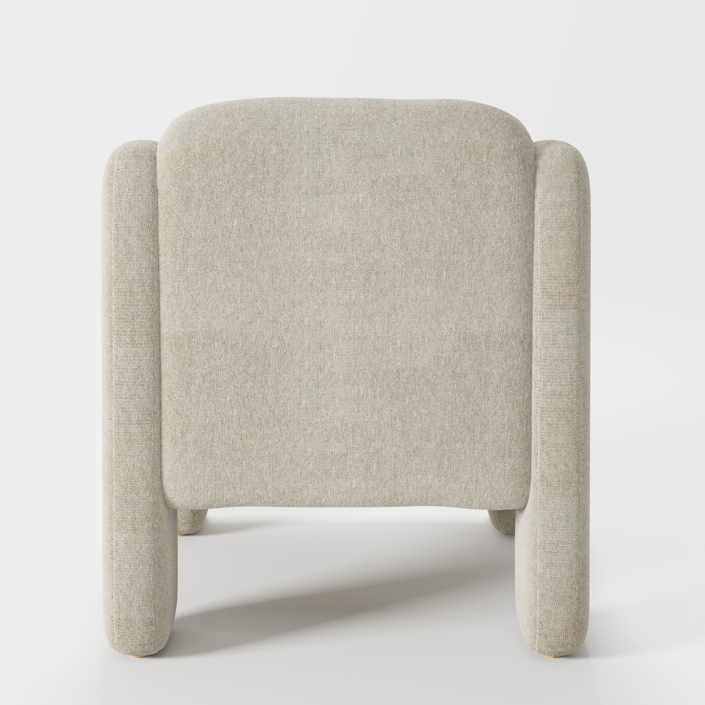 Inny armchair in Alderney Linen Oatmeal shown from the rear highlighting curved backrest and upholstery finish.