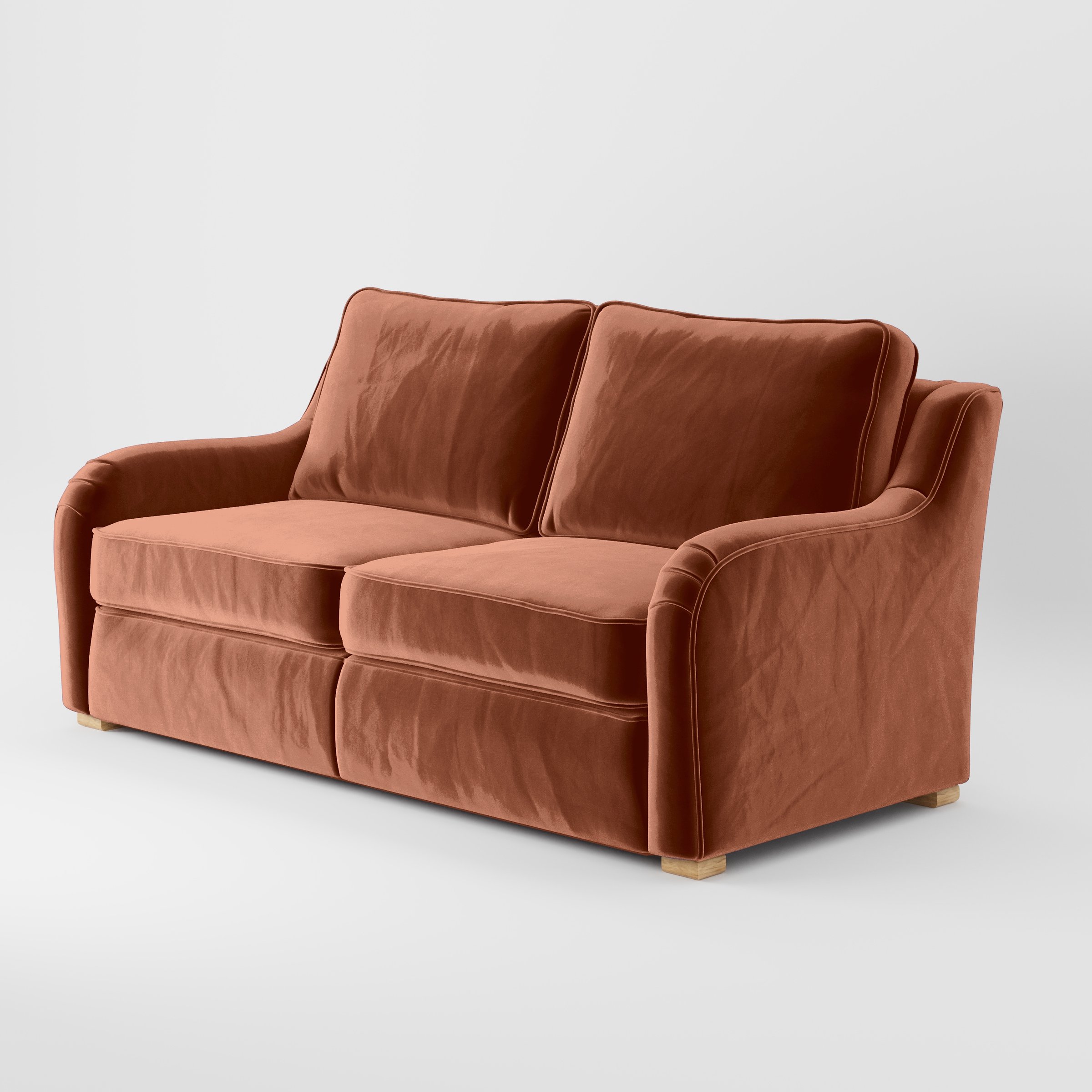 Diagonal view of the Cashel sofa upholstered in Plush EasyClean Velvet in Apricot.