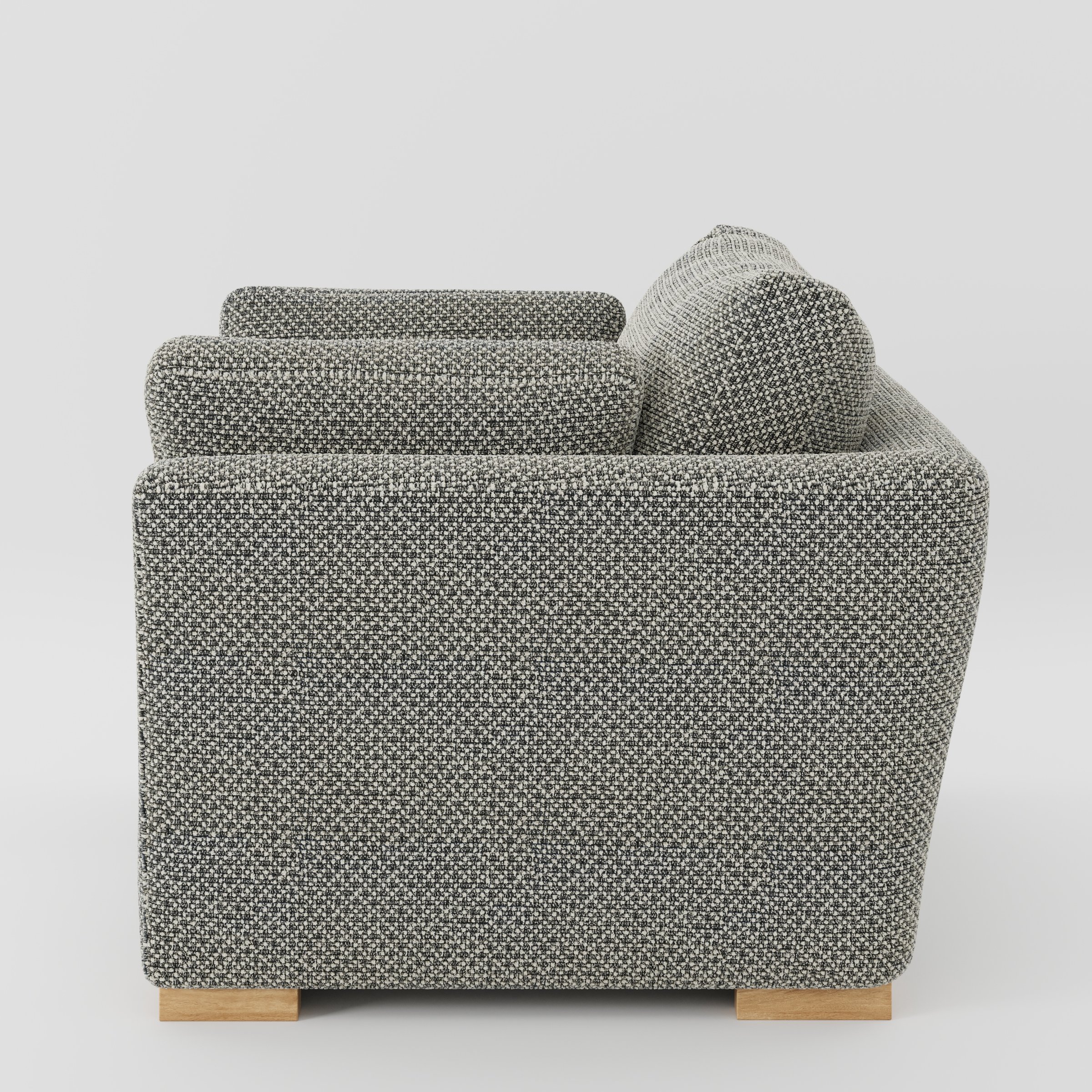 Stowe armchair in Rousay Wool Blend Tar and Chalk shown in side profile displaying proportions and overall silhouette.