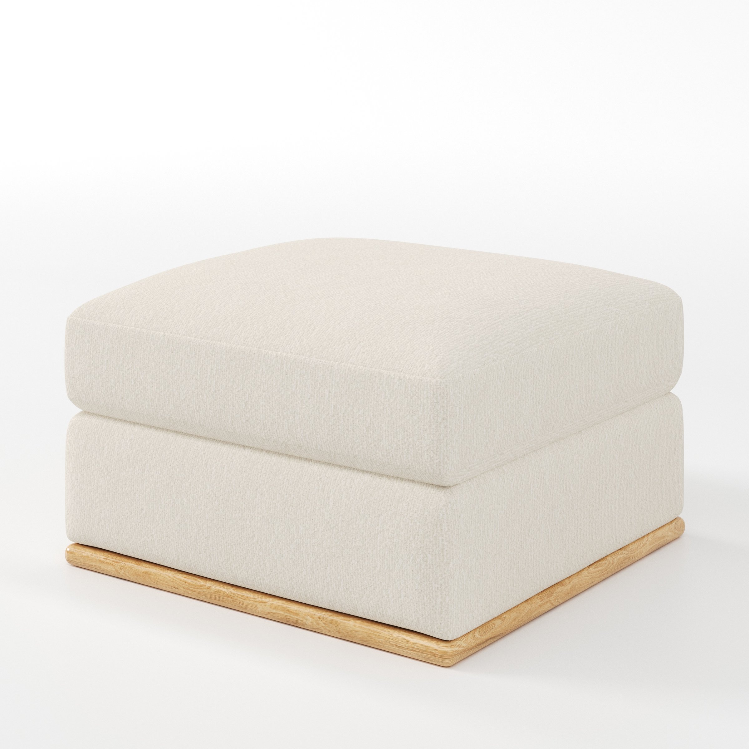 Cusher footstool in Kilda Boucle Cream shown at a diagonal angle highlighting structured form and wooden plinth base.