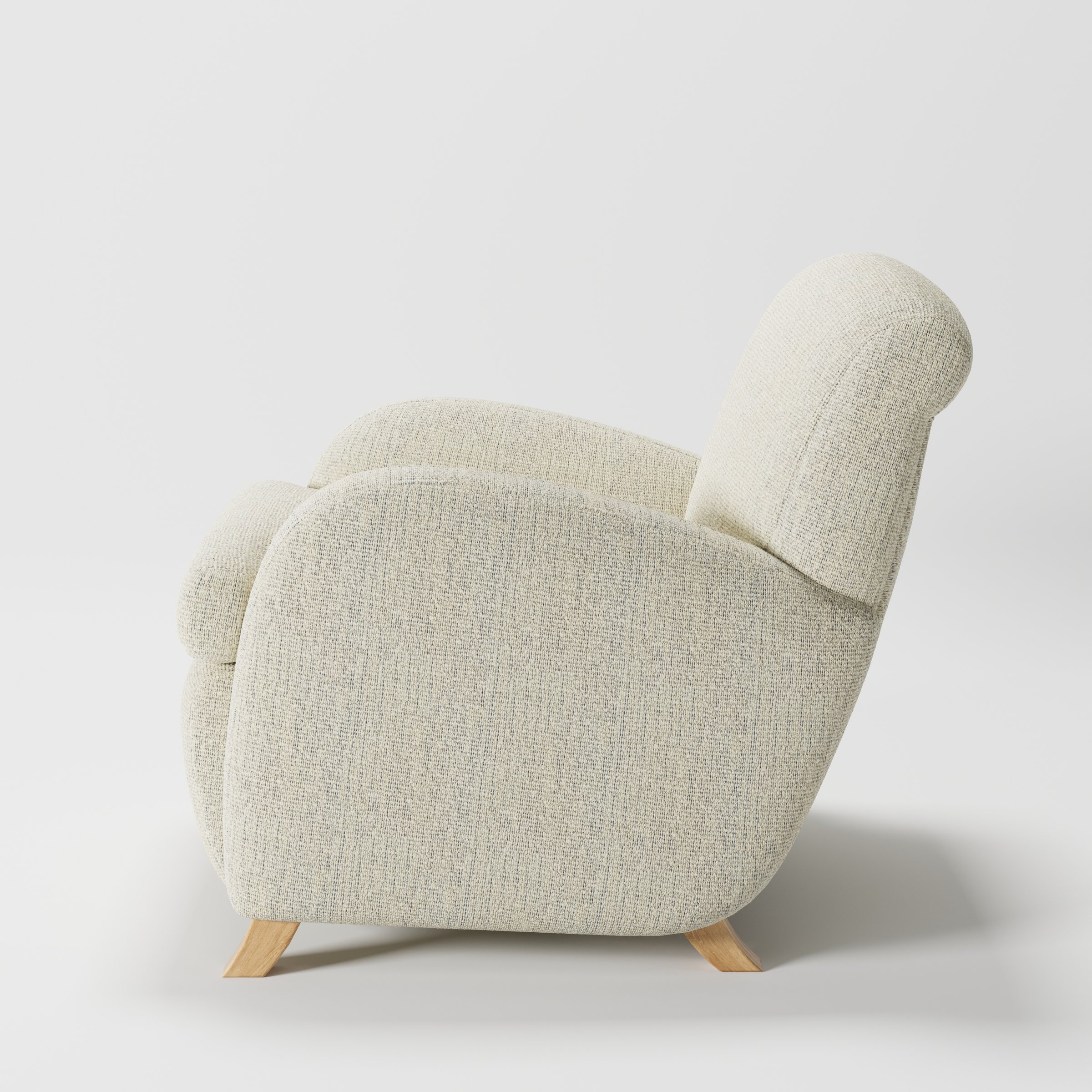 Rye armchair in Orsay Boucle Cream and Marine shown in side profile displaying proportions and overall silhouette.