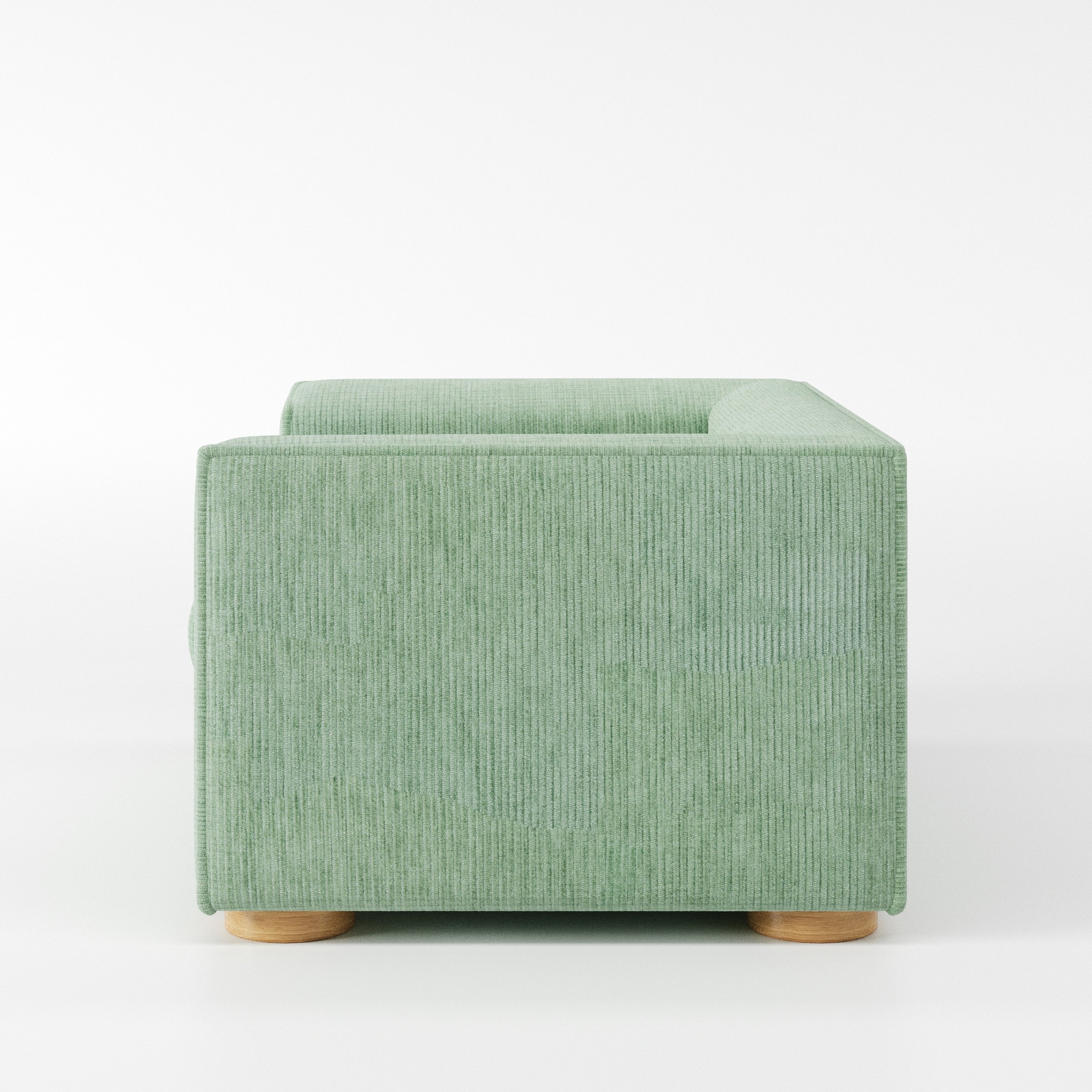 Feale armchair in Caldey Velvet Corduroy Eucalyptus shown in side profile displaying proportions and overall silhouette.