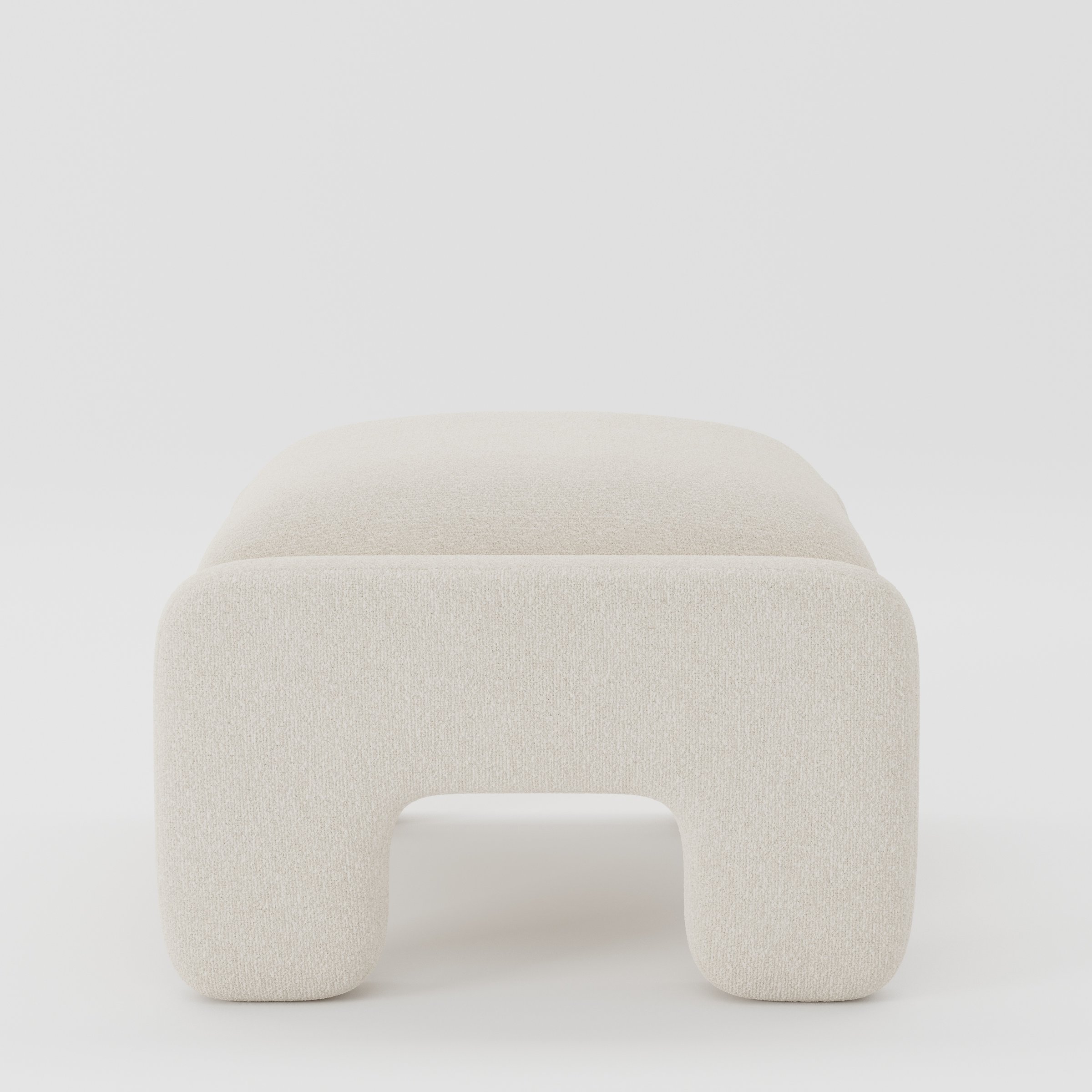 Inny footstool in Kilda bouclé cream fabric, side view emphasising minimal profile and continuous upholstery