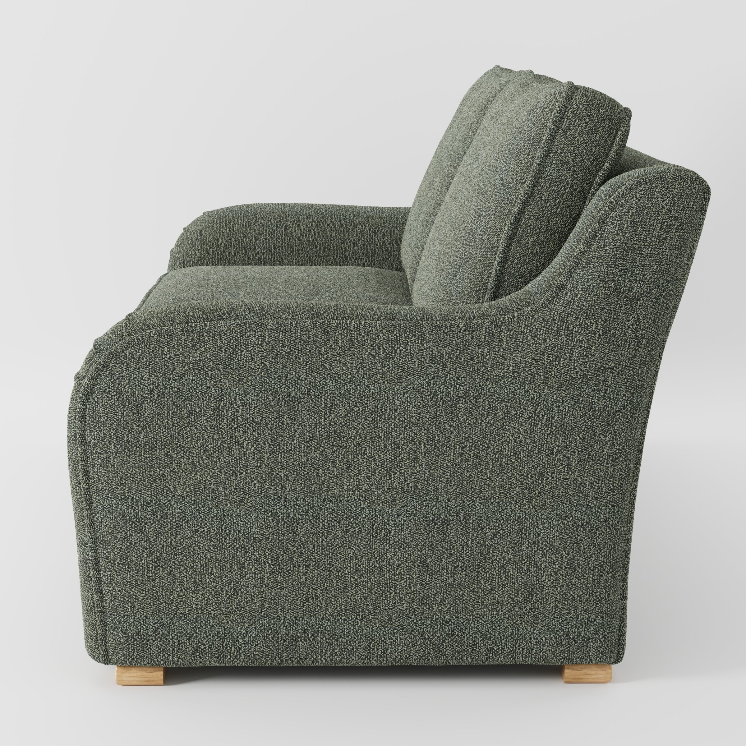 Cashel sofa in Kilda Boucle Moss shown in side profile displaying proportions and overall silhouette.
