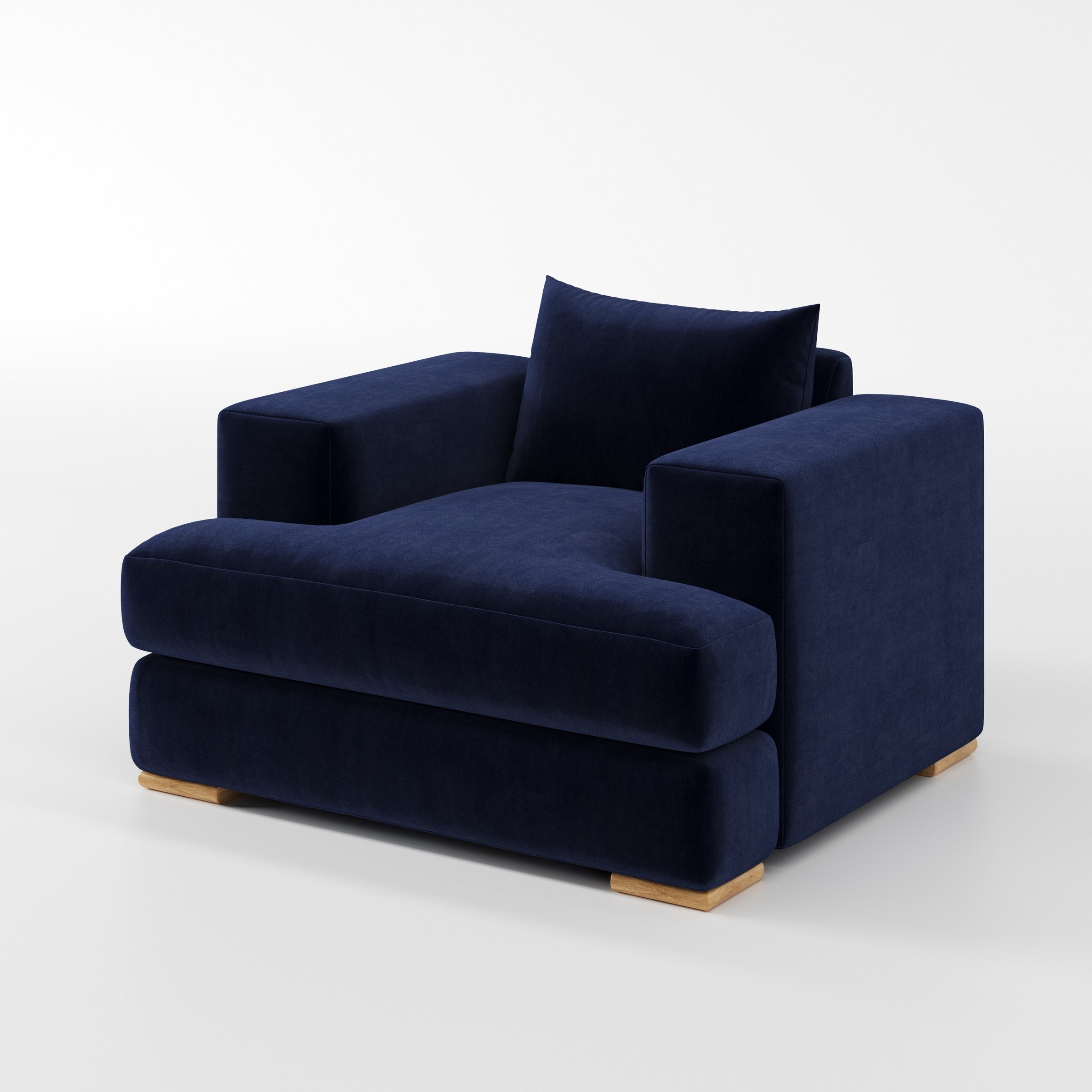 Fane armchair in Noss Velvet Navy shown at a diagonal angle highlighting arms and seat depth.