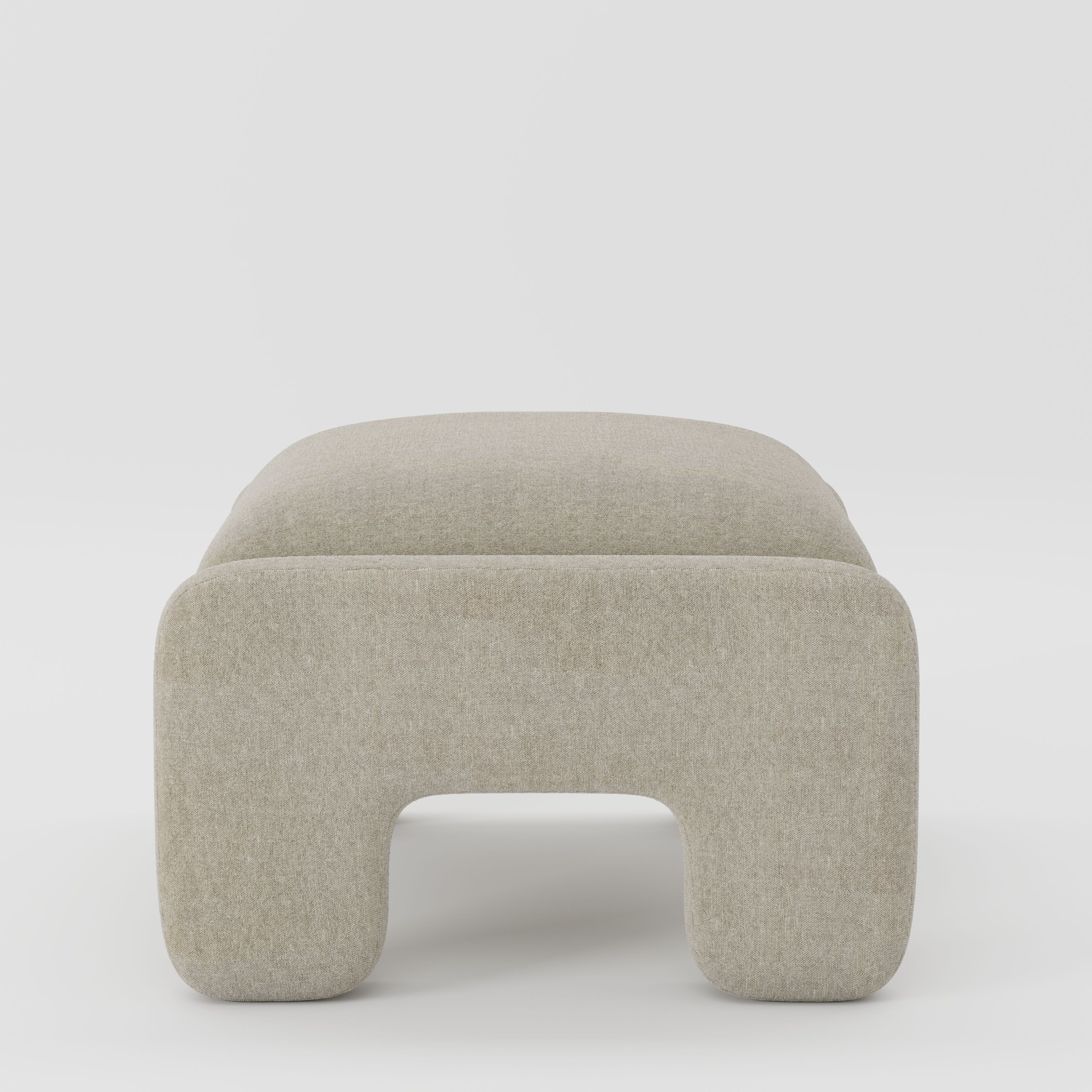 Inny footstool in Alderney linen oatmeal fabric, side view emphasising understated profile and light texture