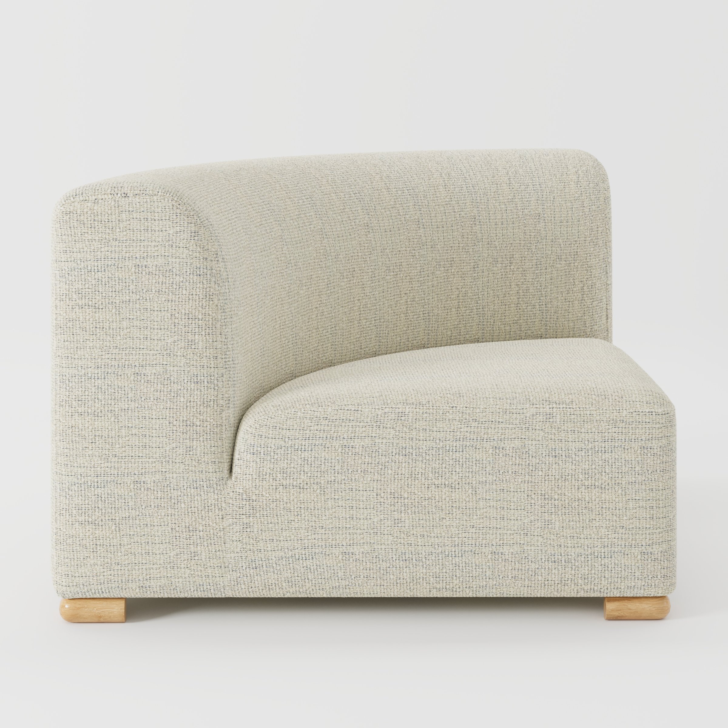 Tay corner sofa unit in Orsay Bouclé Cream and Marine shown from the side highlighting the curved backrest and deep seat with timber feet.