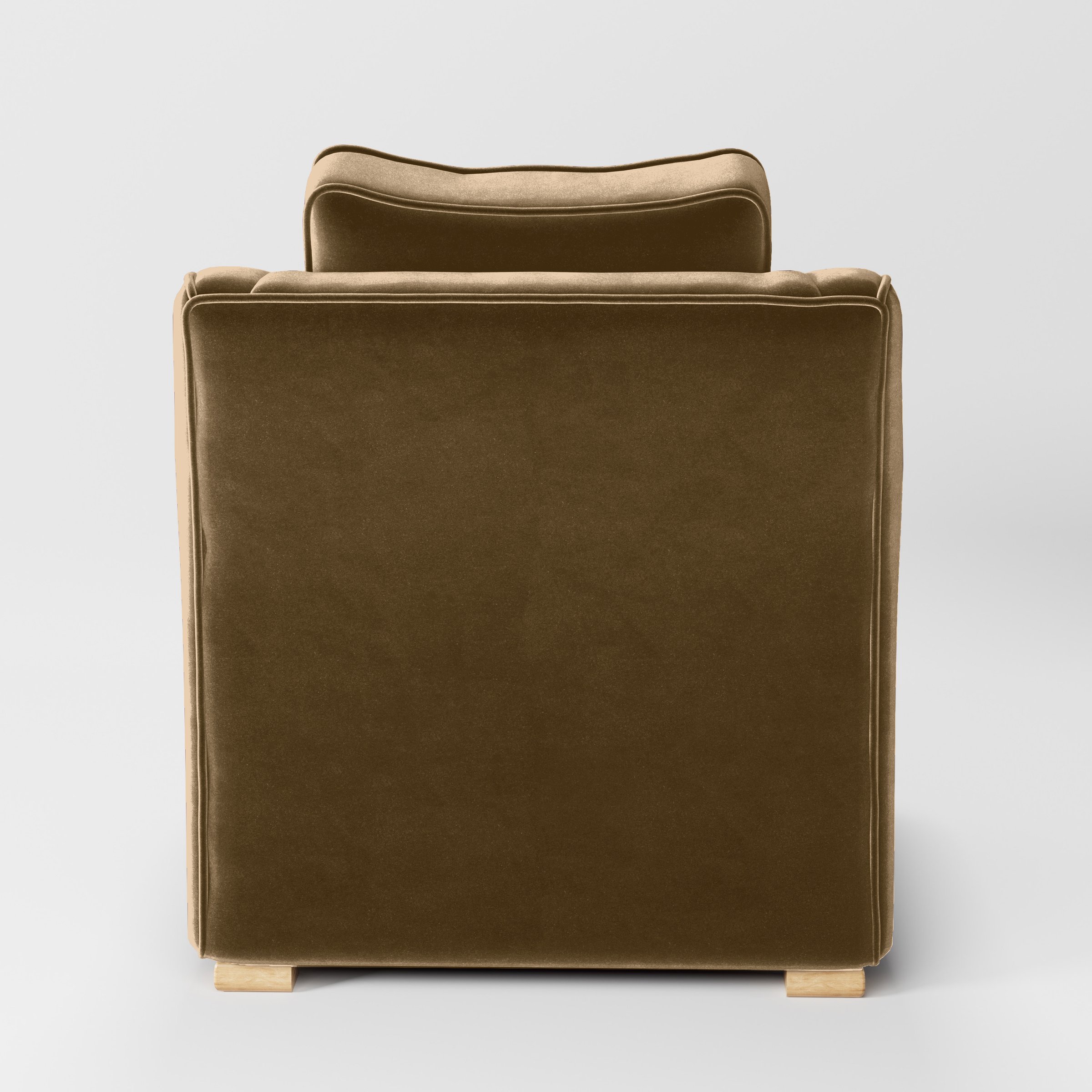 Rear view of the Cashel armchair upholstered in Plush EasyClean Velvet in Caribou.
