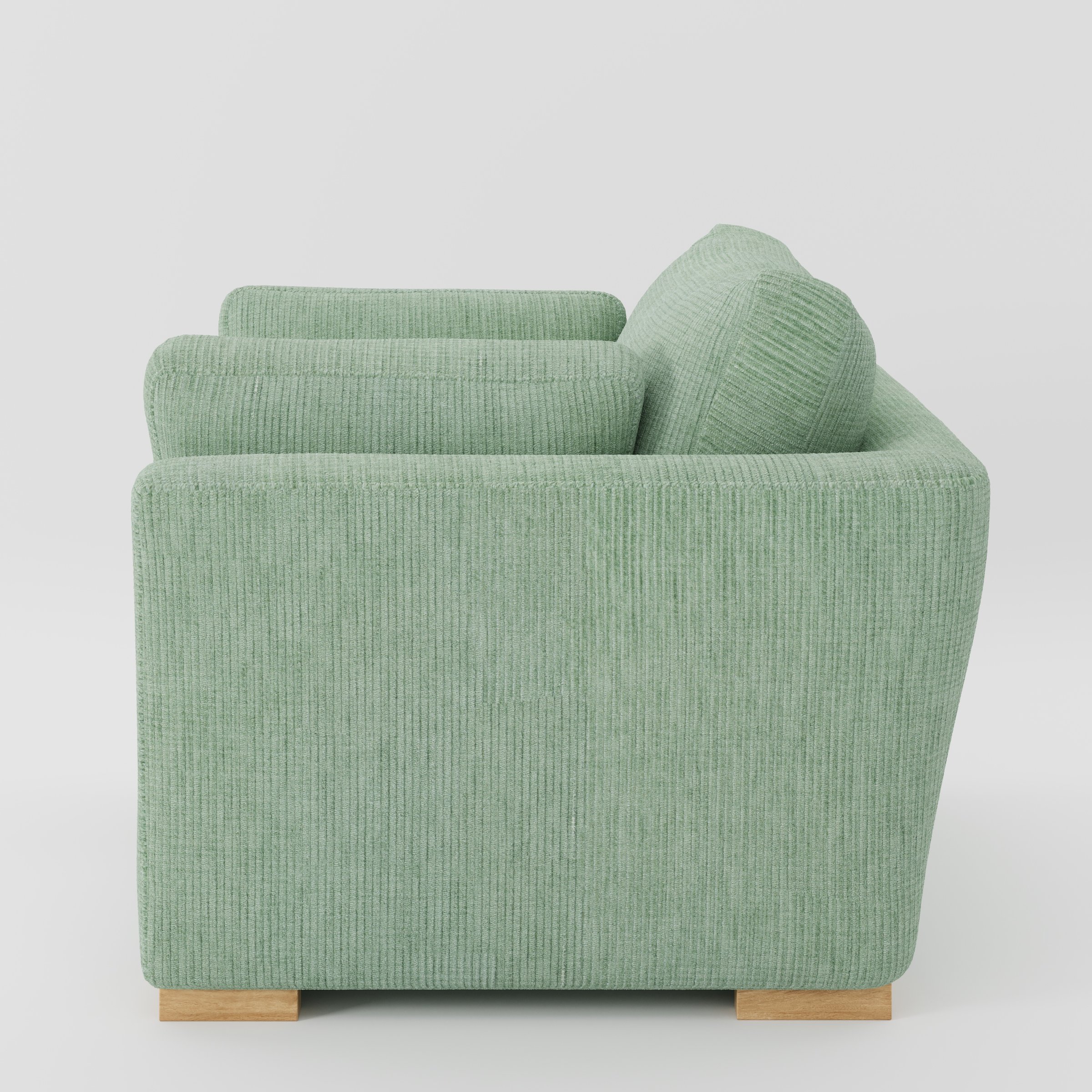 Stowe armchair in Caldey Velvet Corduroy Eucalyptus shown in side profile displaying proportions and overall silhouette.