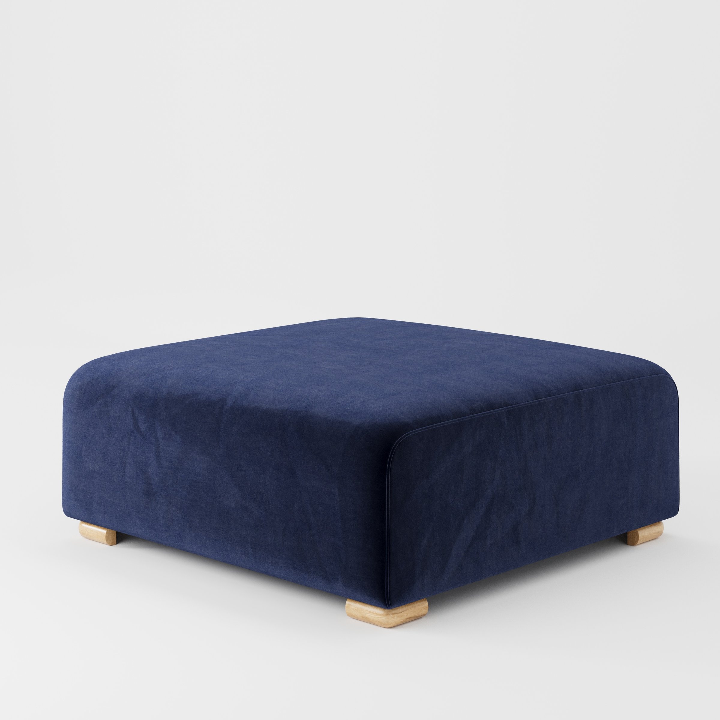 Tay footstool in Noss Velvet Navy shown at a diagonal angle highlighting clean edges and compact form.
