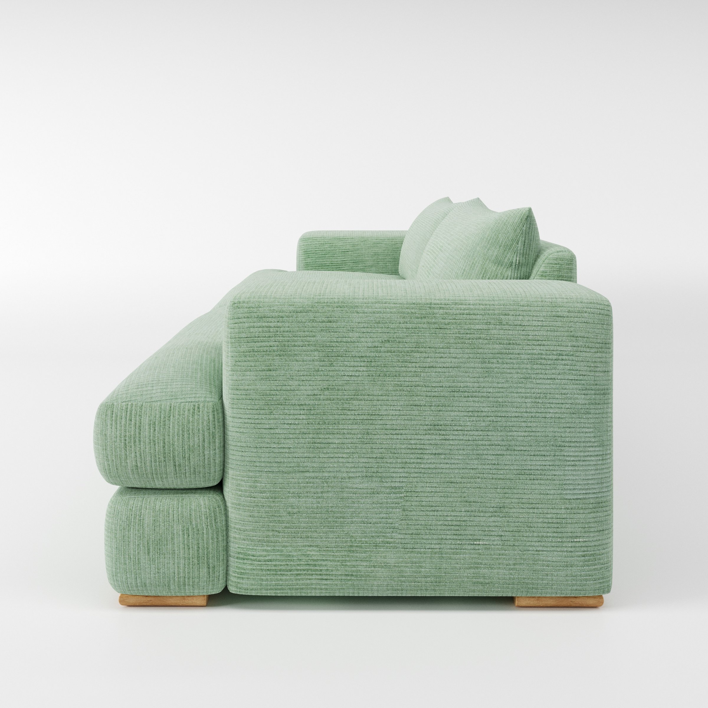 Fane sofa in Caldey Velvet Corduroy Eucalyptus shown in side profile displaying proportions and overall silhouette.