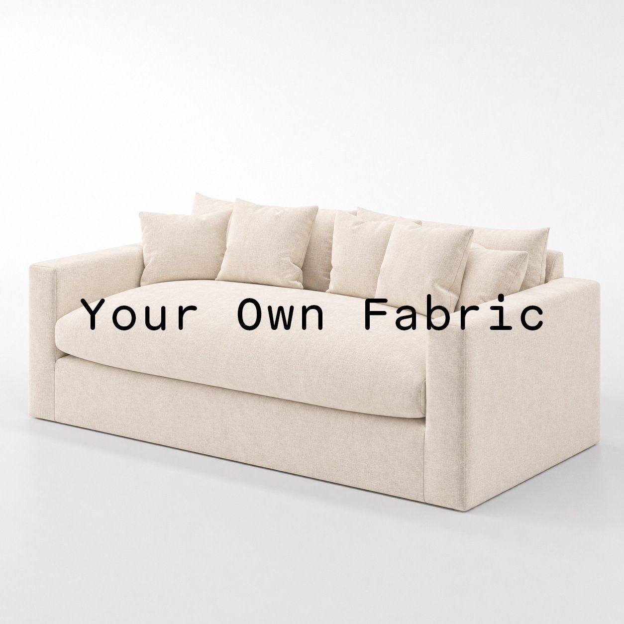 Diagonal view of the Coniston sofa upholstered in customers own material calico cotton fabric.