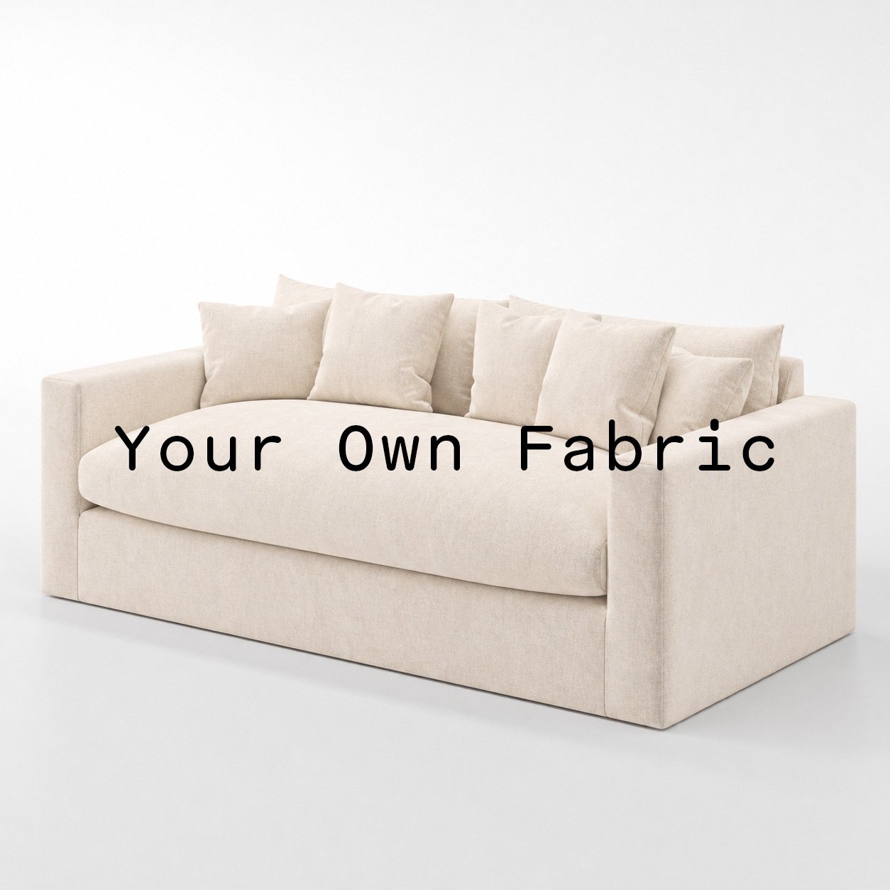 Diagonal view of the Coniston sofa upholstered in customers own material calico cotton fabric.