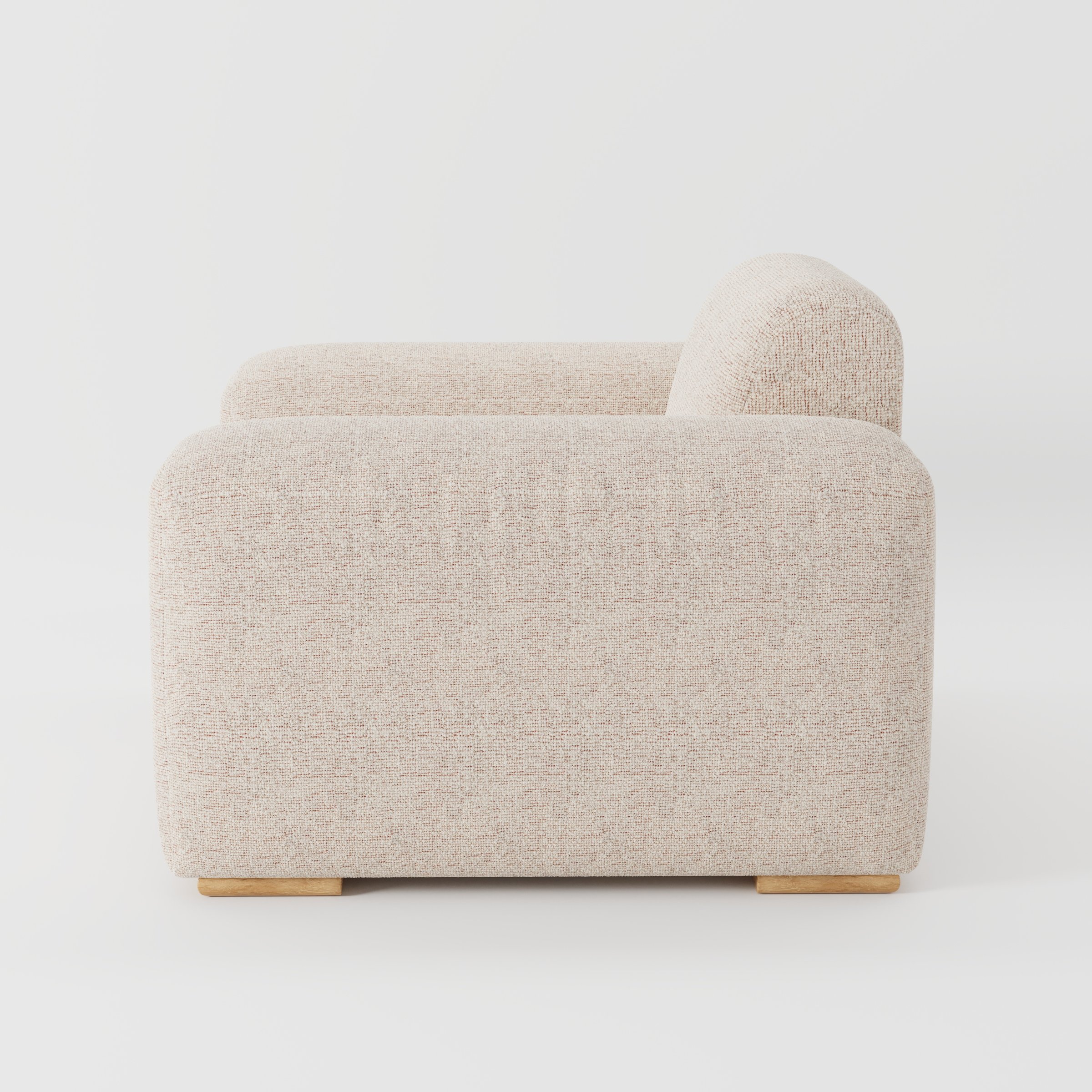 Darwell armchair in Orsay Boucle Cream and Copper shown in side profile displaying proportions and overall silhouette.