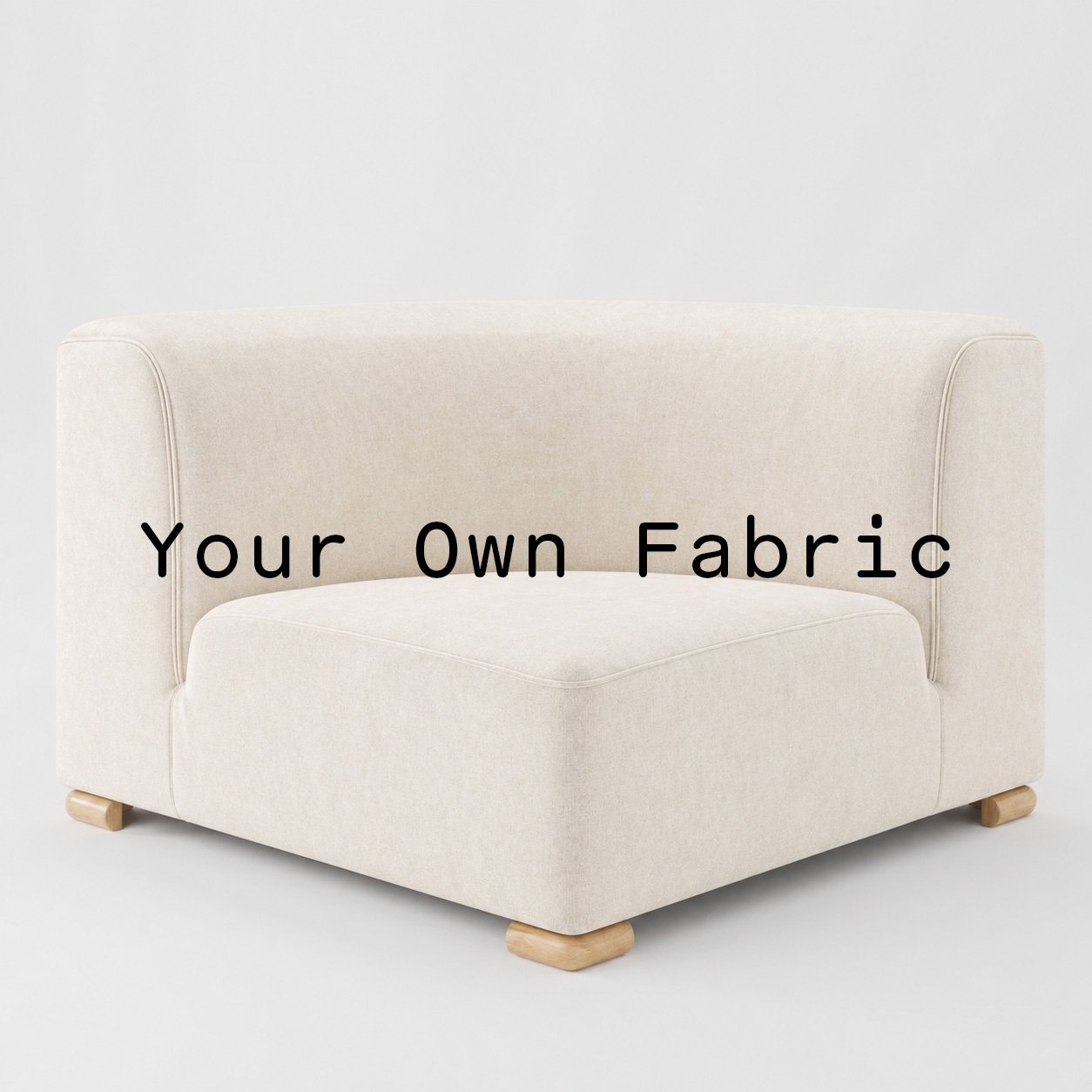 Diagonal view of the Tay corner unit upholstered in customers own material calico cotton fabric.