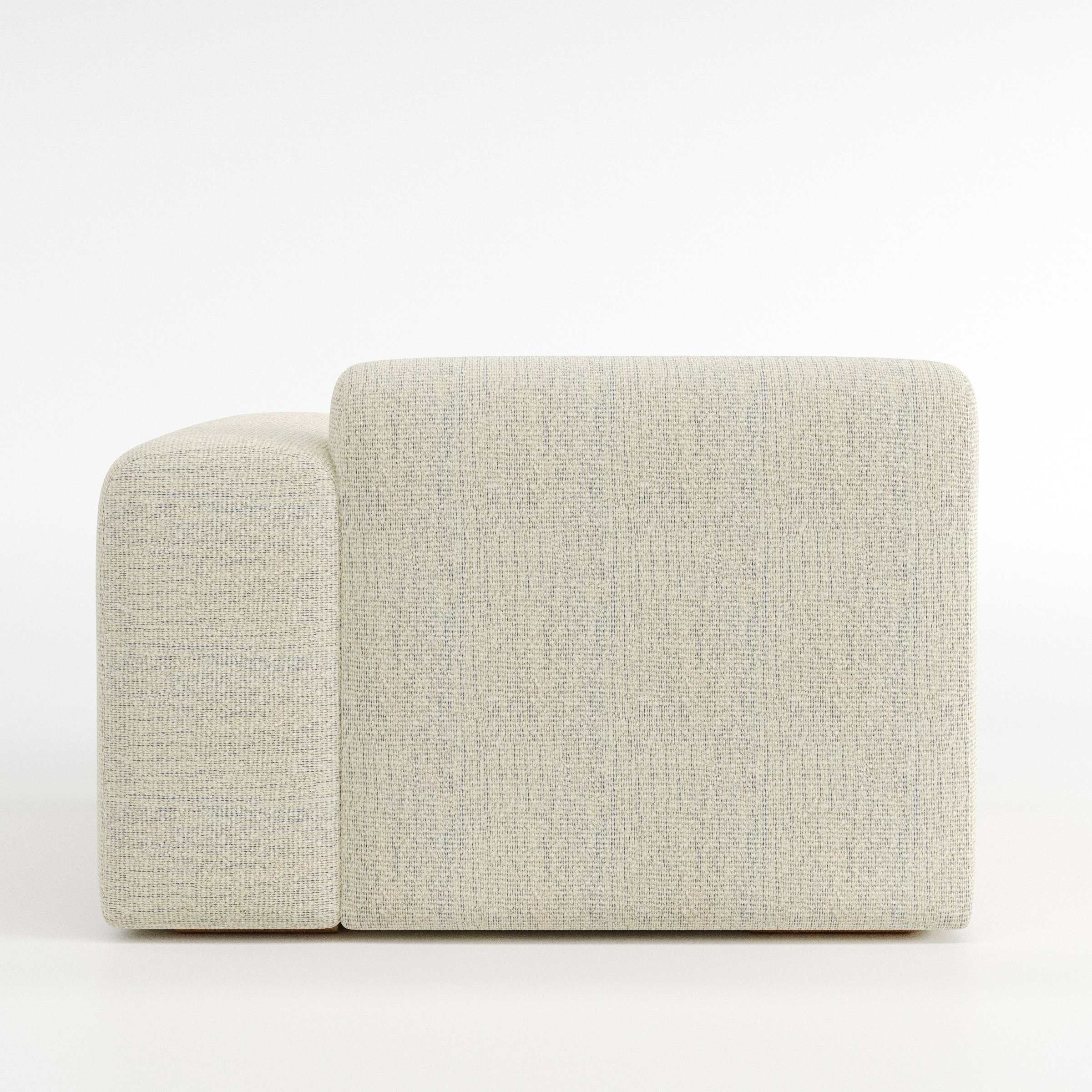Drumquin modular sofa right side unit in Orsay Bouclé Cream and Marine shown from the back with a smooth, softly curved silhouette and armrest edge visible.