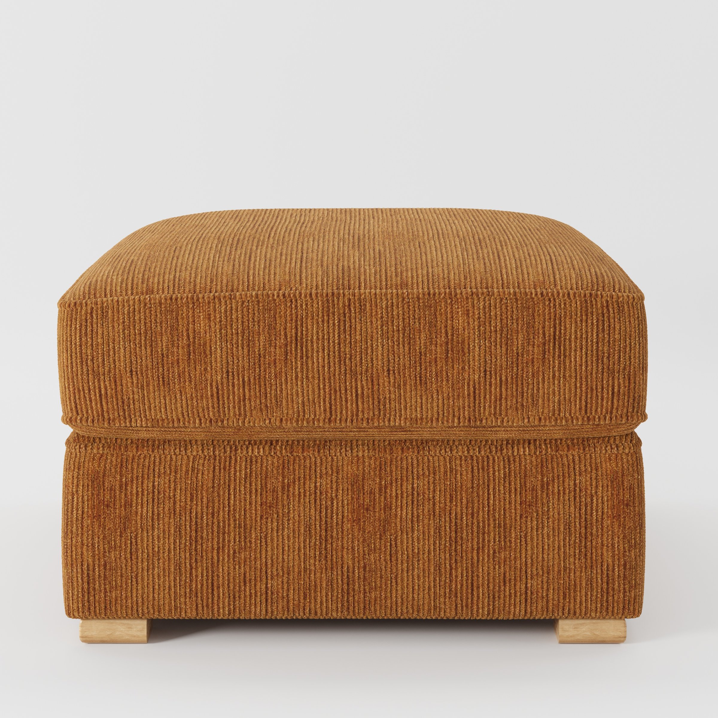 Cashel footstool in Caldey Velvet Corduroy Tobacco shown front-on against a neutral studio backdrop.