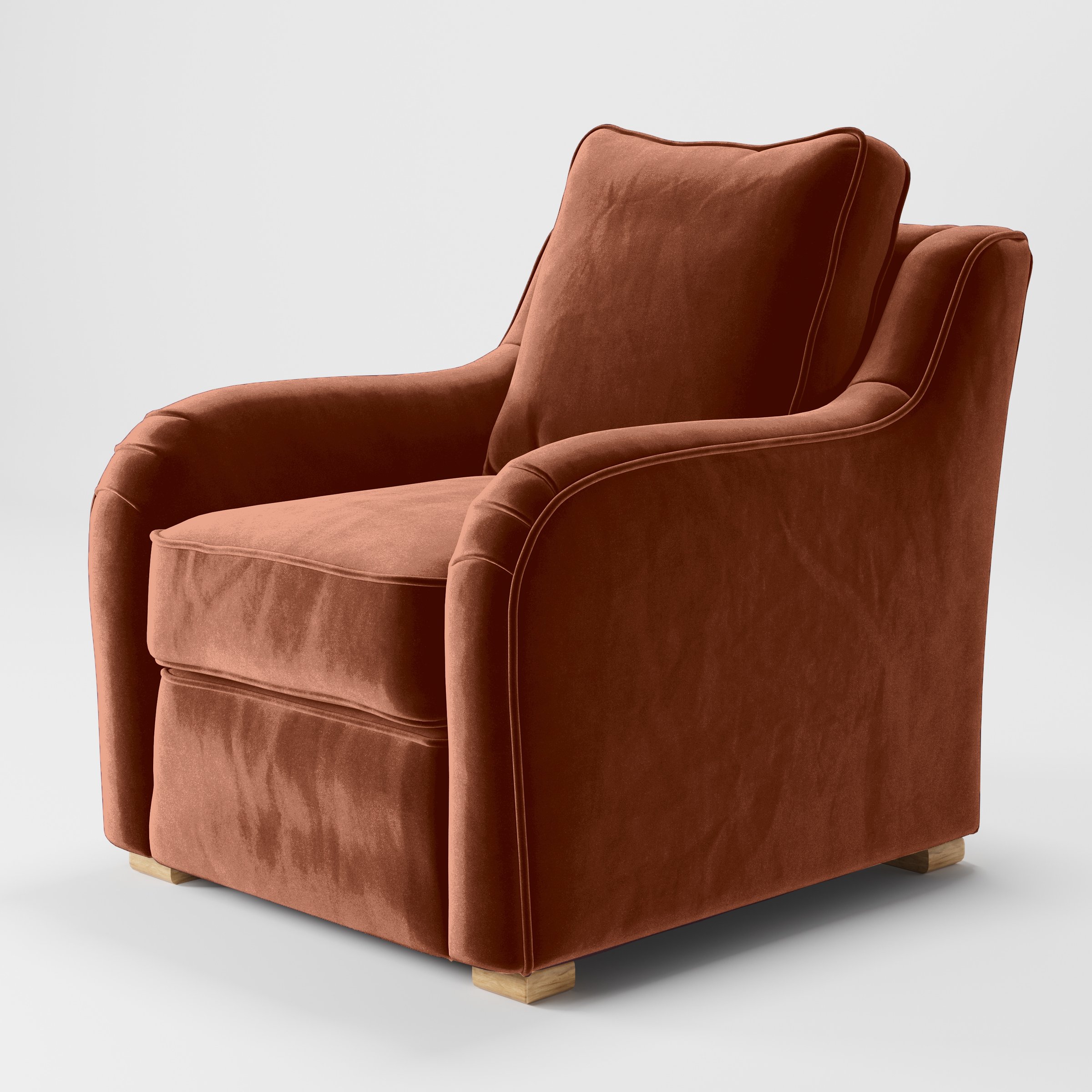 Diagonal view of the Cashel armchair upholstered in Plush EasyClean Velvet in Apricot.