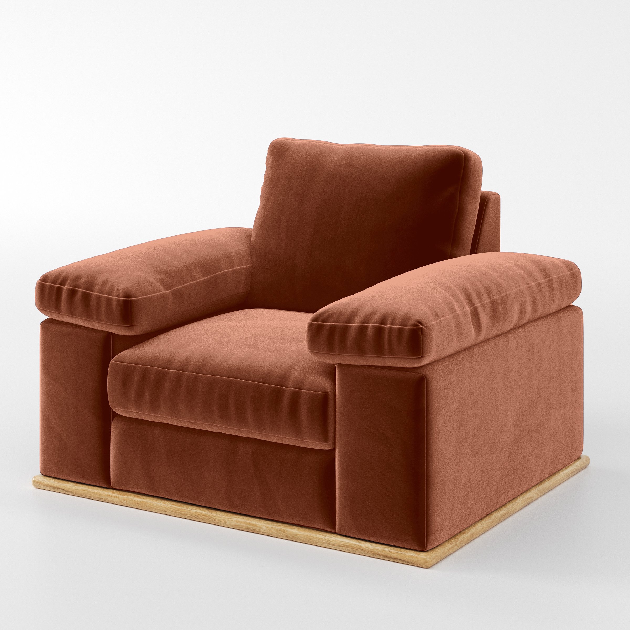 Diagonal view of the Cusher armchair upholstered in Plush EasyClean Velvet in Apricot.