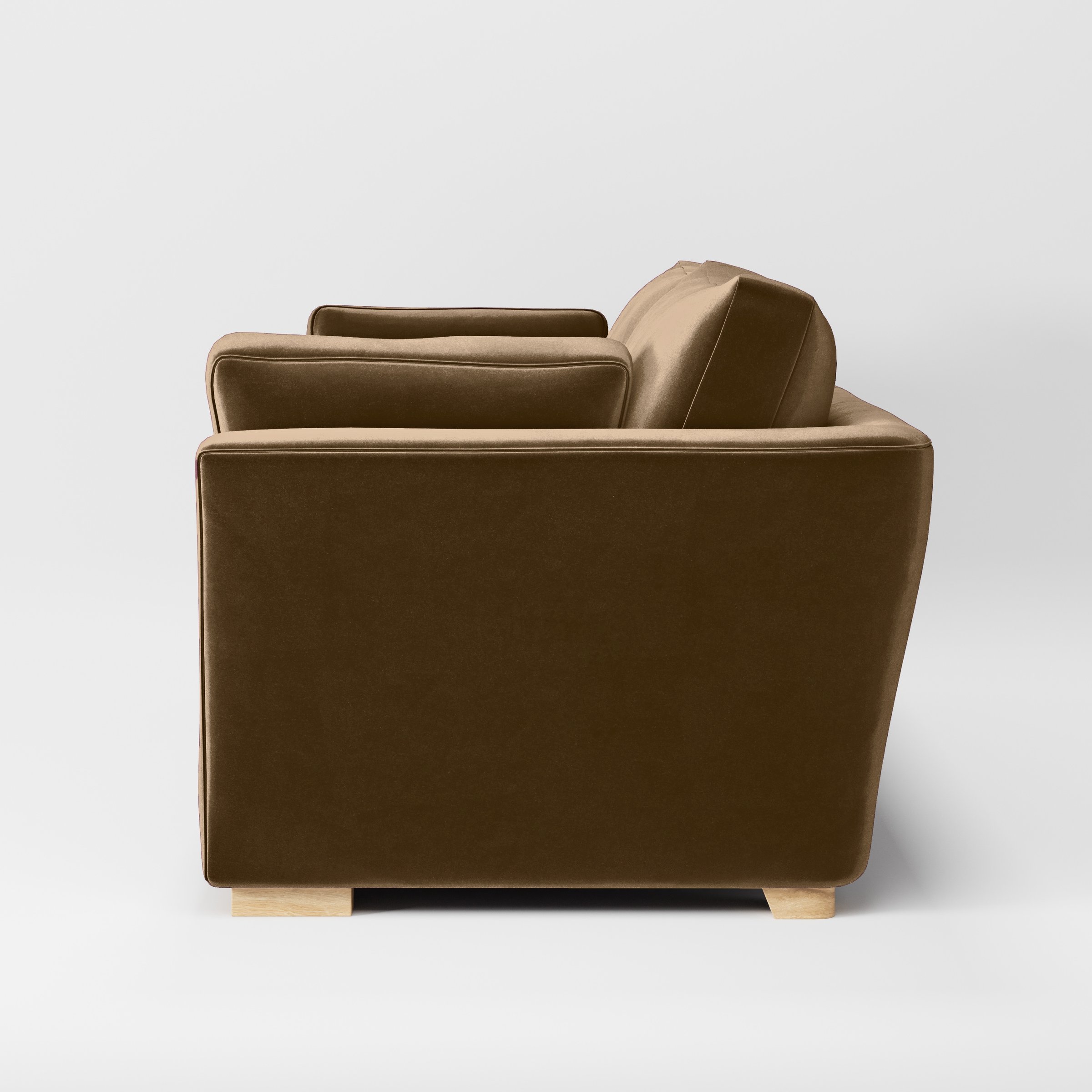 Side view of the Stowe sofa upholstered in Plush EasyClean Velvet in Caribou.