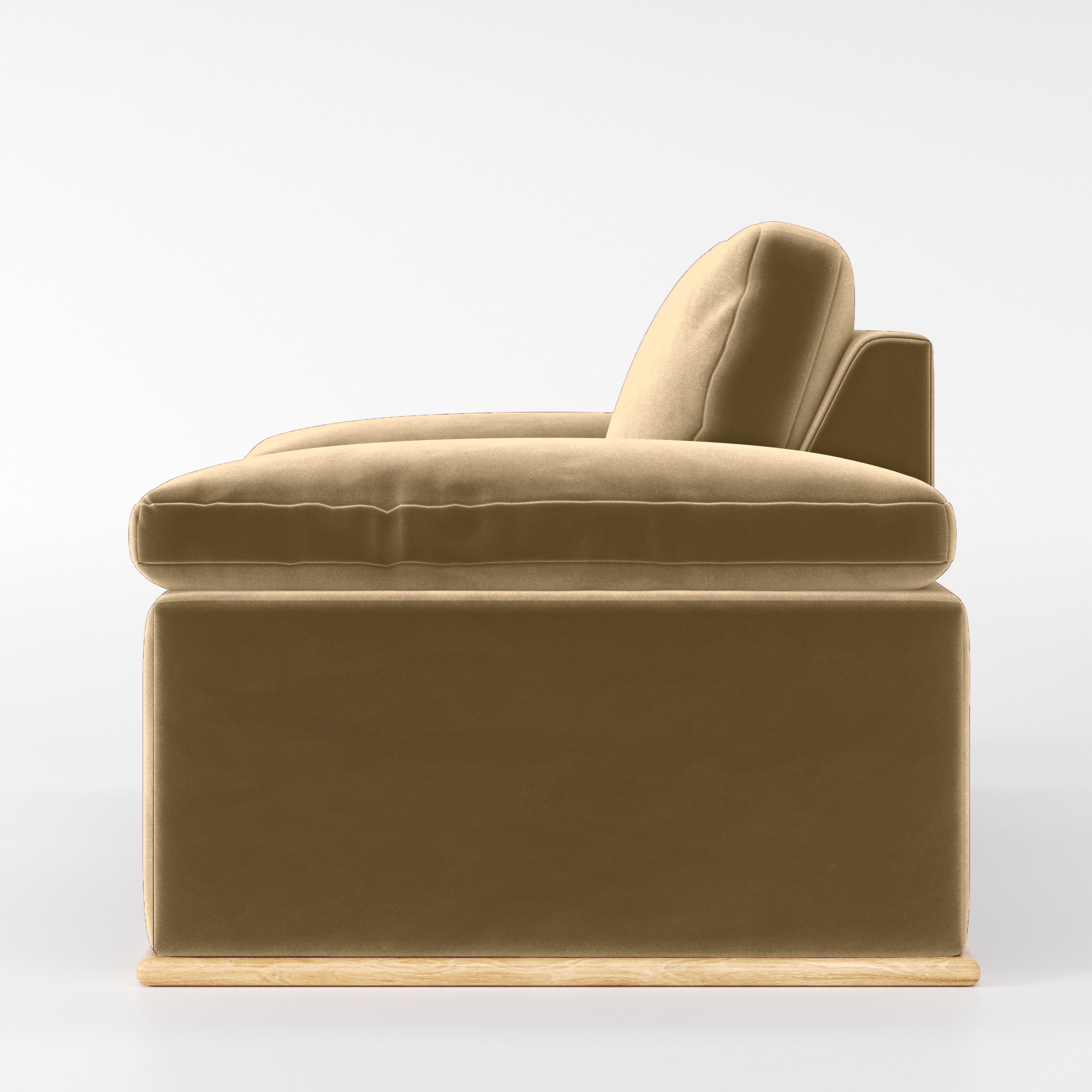 Side view of the Cusher armchair upholstered in Plush EasyClean Velvet in Cafe.