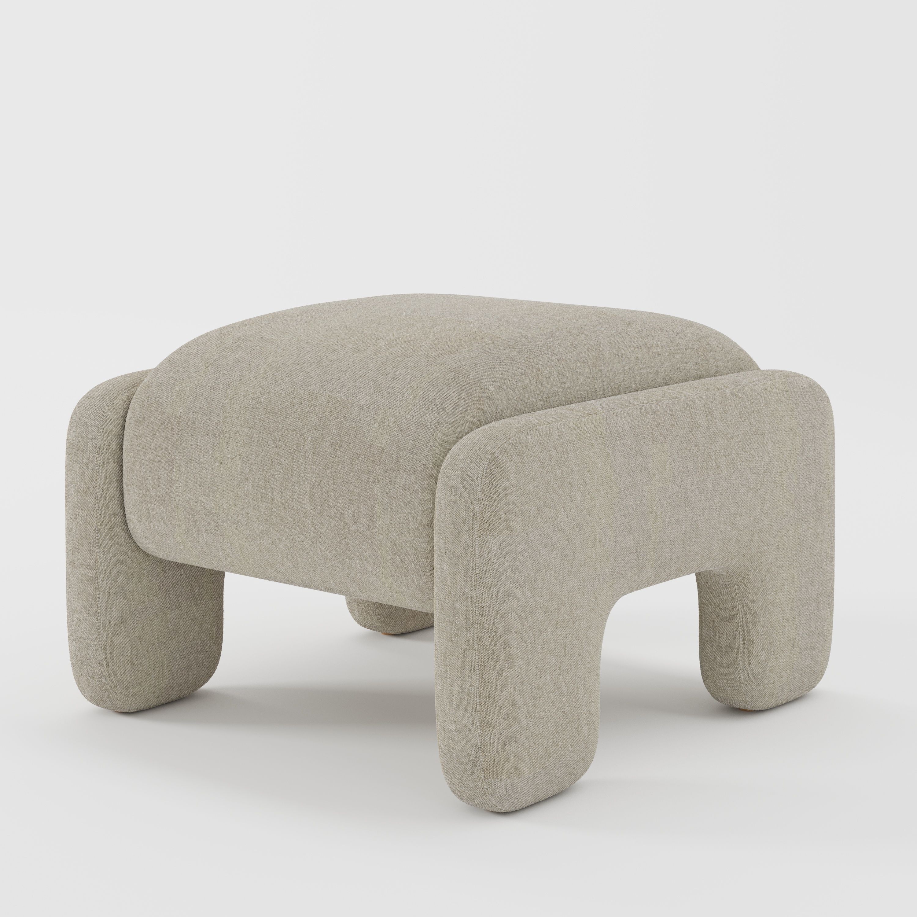 Inny footstool in Alderney linen oatmeal fabric, diagonal view highlighting relaxed silhouette and breathable woven finish