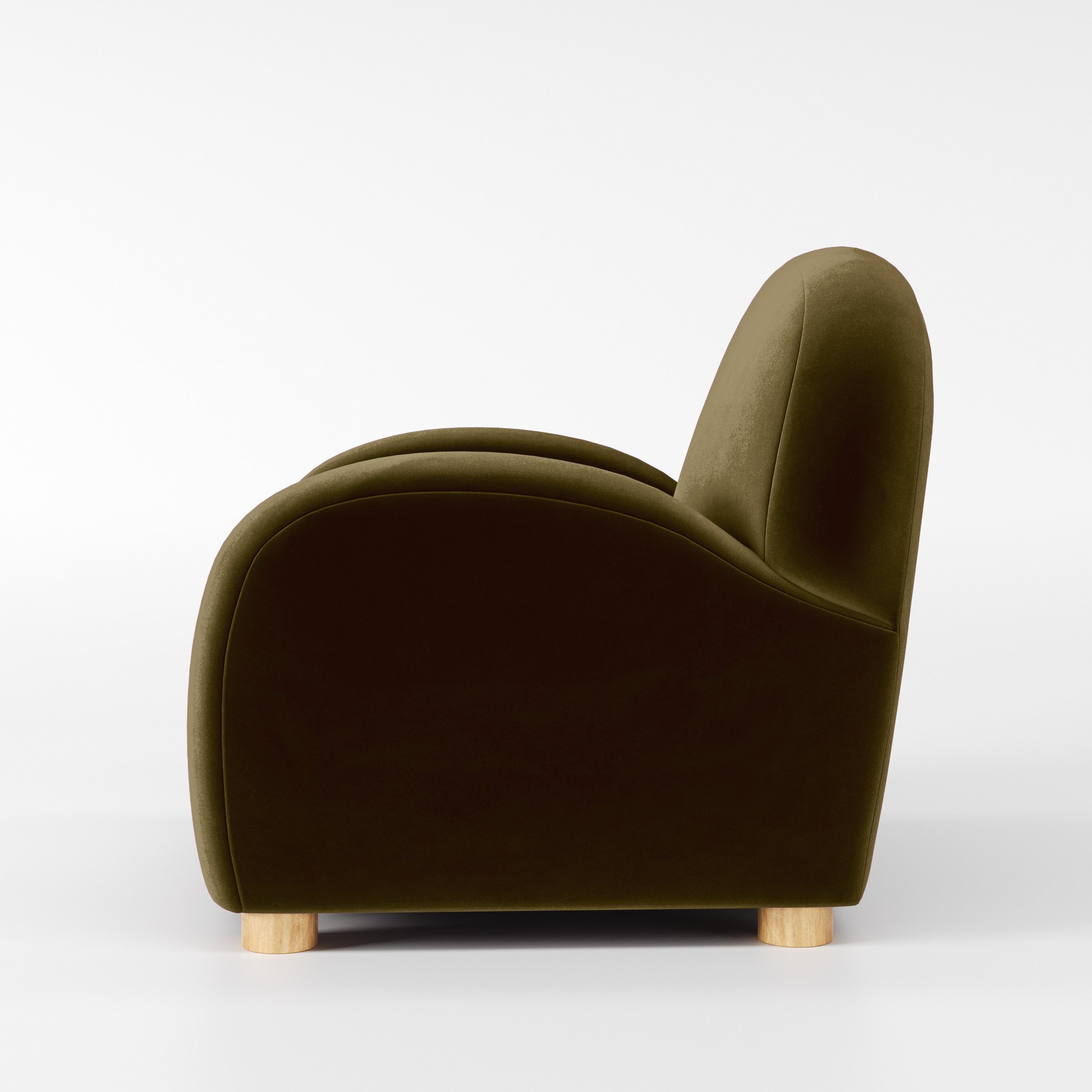 Side view of the Awe armchair upholstered in Plush EasyClean Velvet in Cedar.