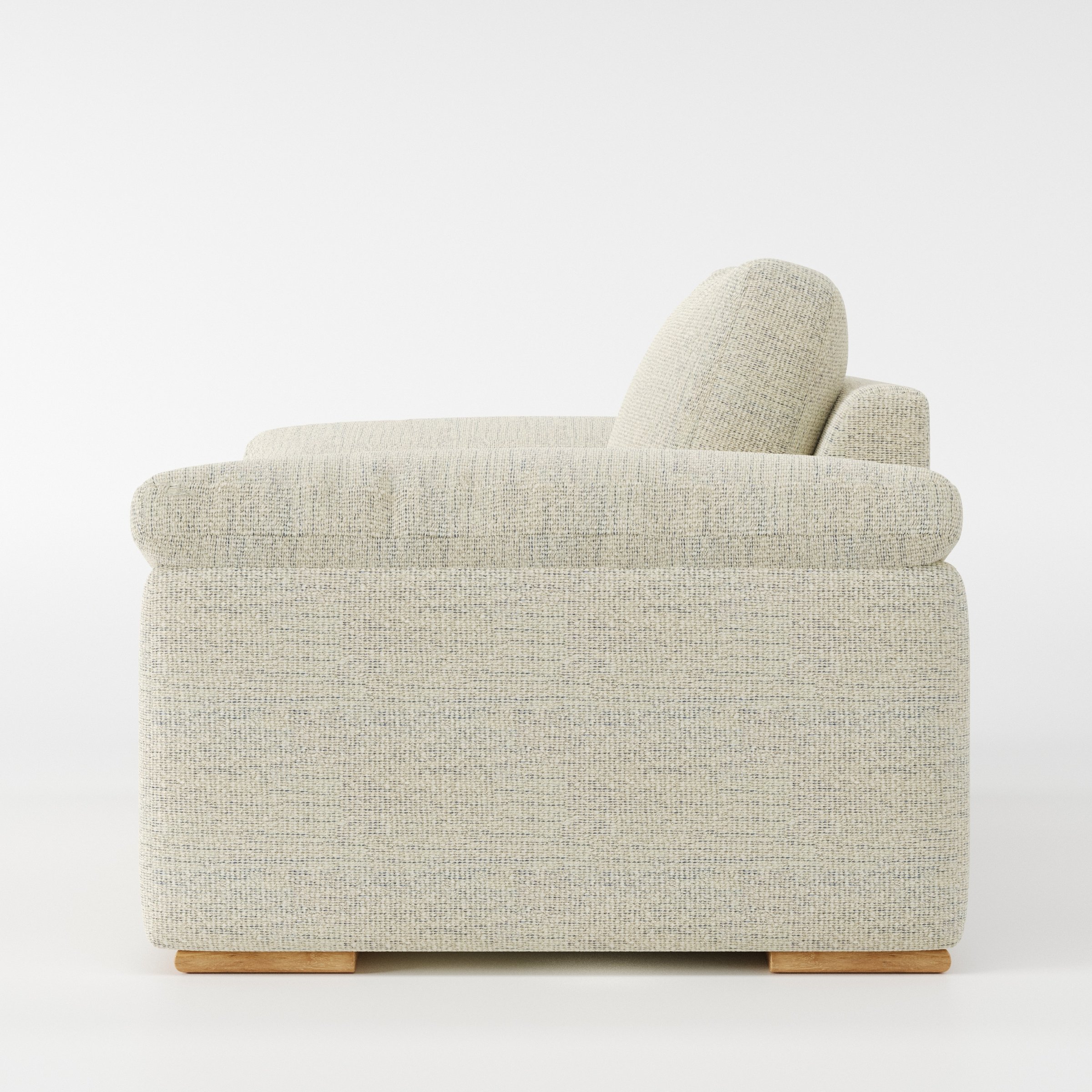 Moy armchair in Orsay Boucle Cream and Marine shown in side profile displaying proportions and overall silhouette.
