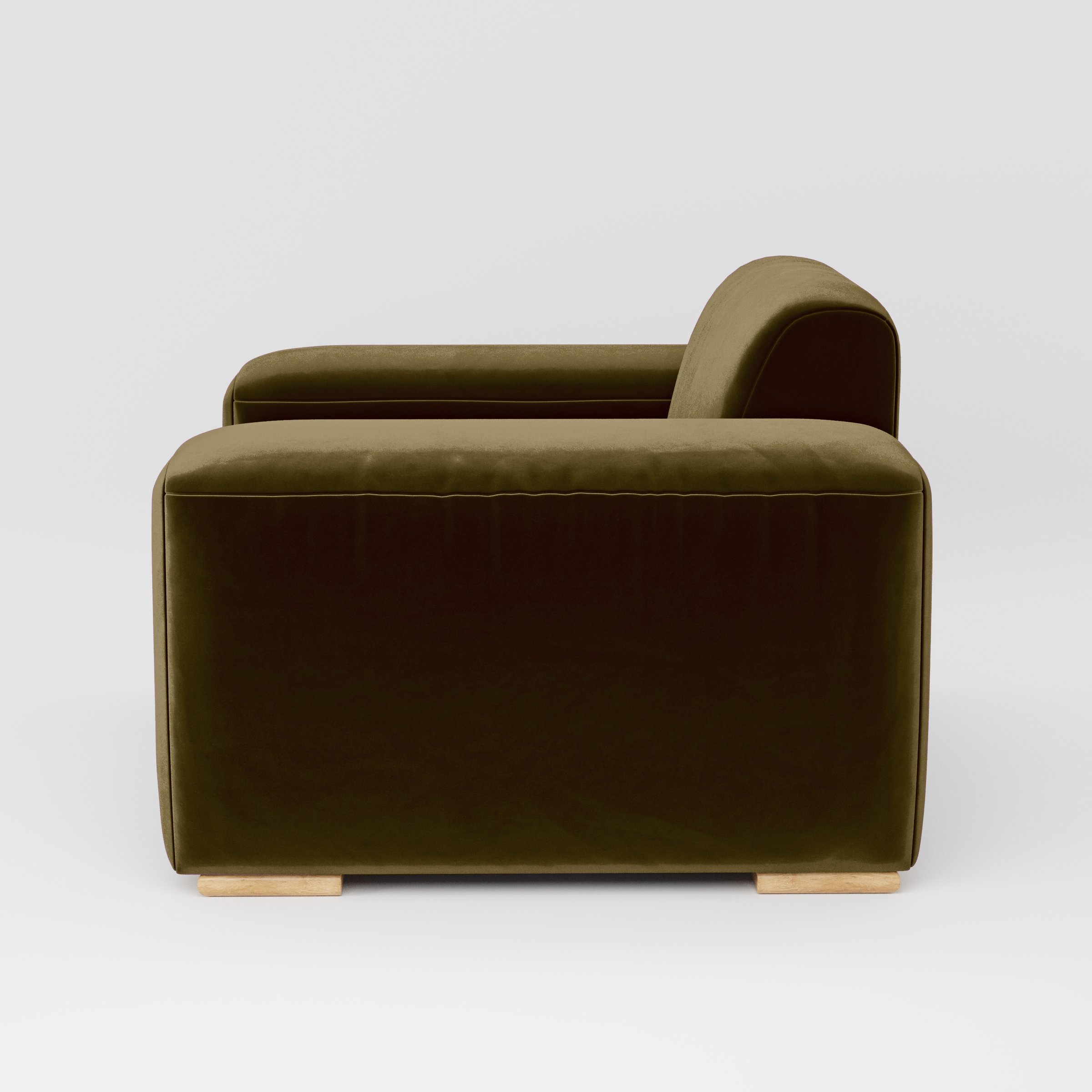 Side view of the Darwell armchair upholstered in Plush EasyClean Velvet in Cedar.