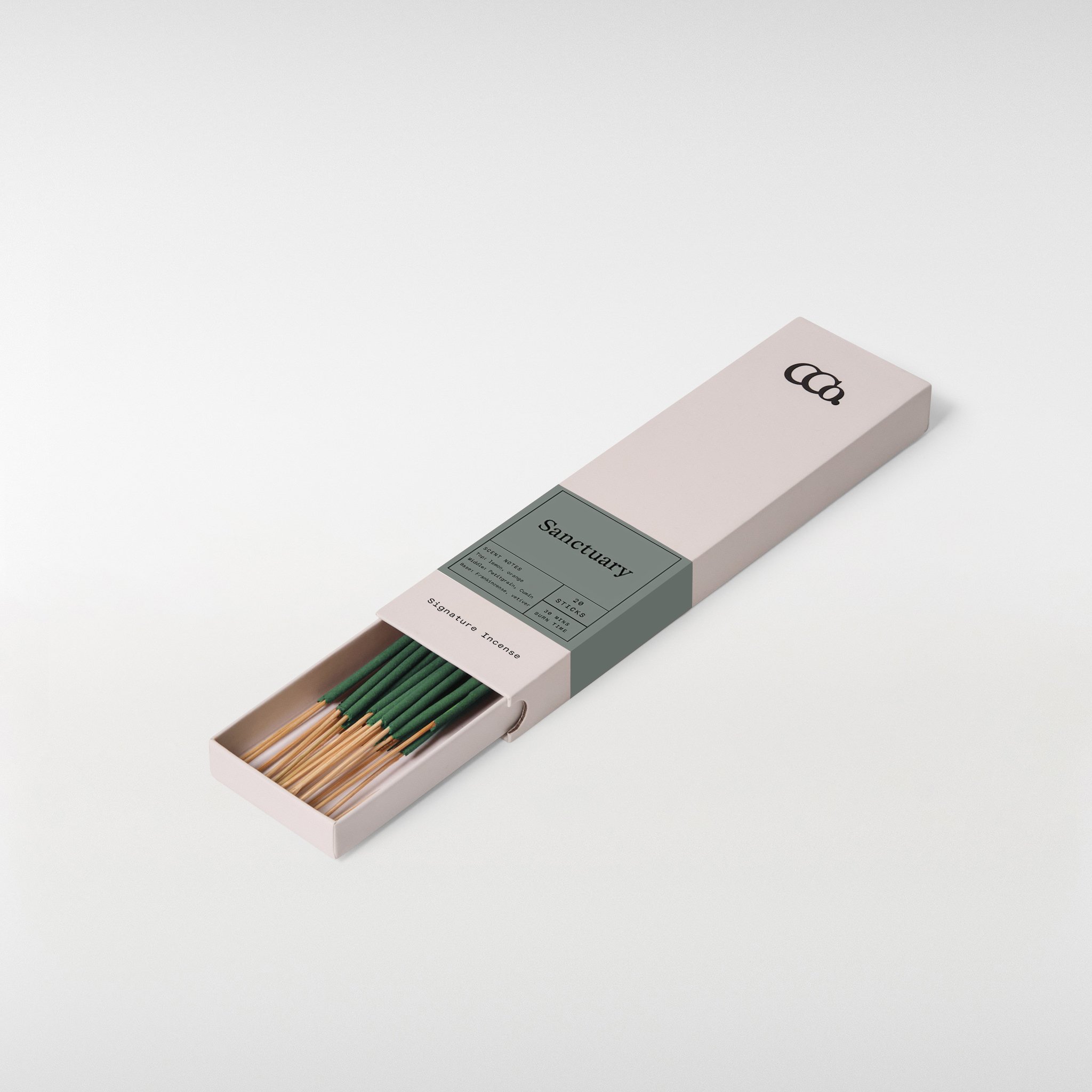 Sanctuary incense, 8 inch sticks in a minimal sliding box with soft green label, partially open showing neatly arranged incense sticks with fresh citrus and warm grounding wood scent notes