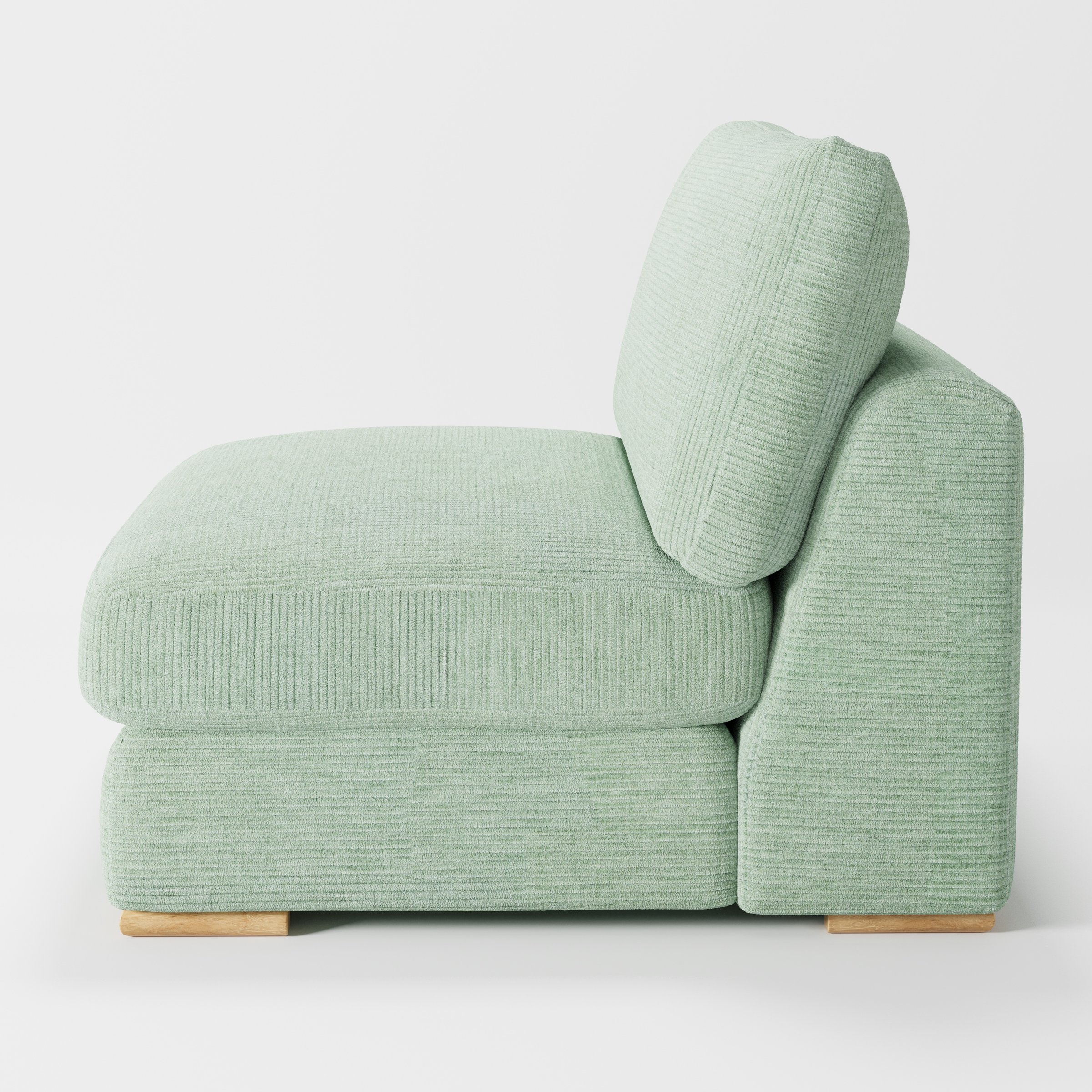 Olton single sofa unit in Caldey Velvet Corduroy Eucalyptus shown from the side showing the layered seat cushion and angled back cushion with timber feet.