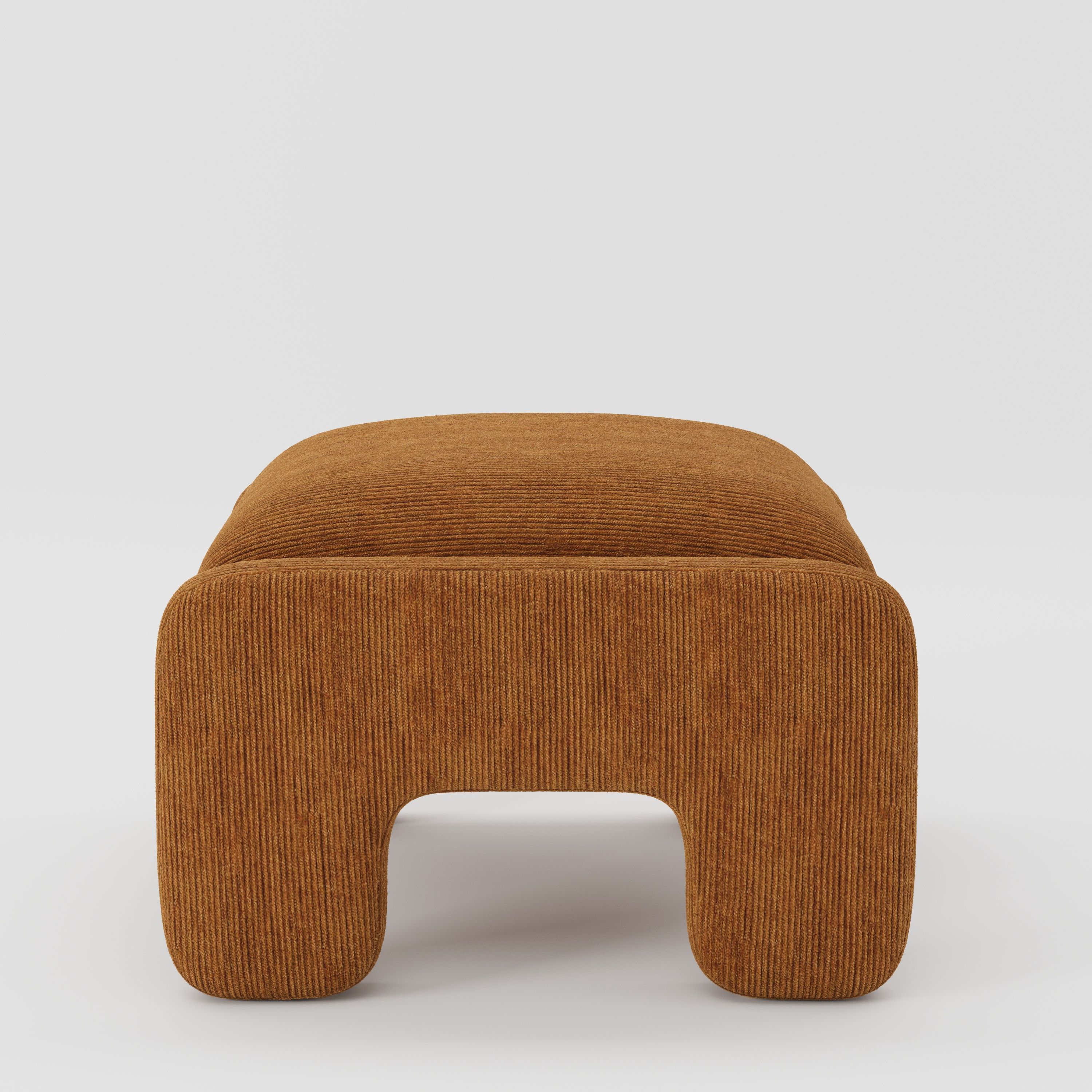 Inny footstool in Caldey velvet corduroy tobacco fabric, side view emphasising low profile and structured upholstered legs