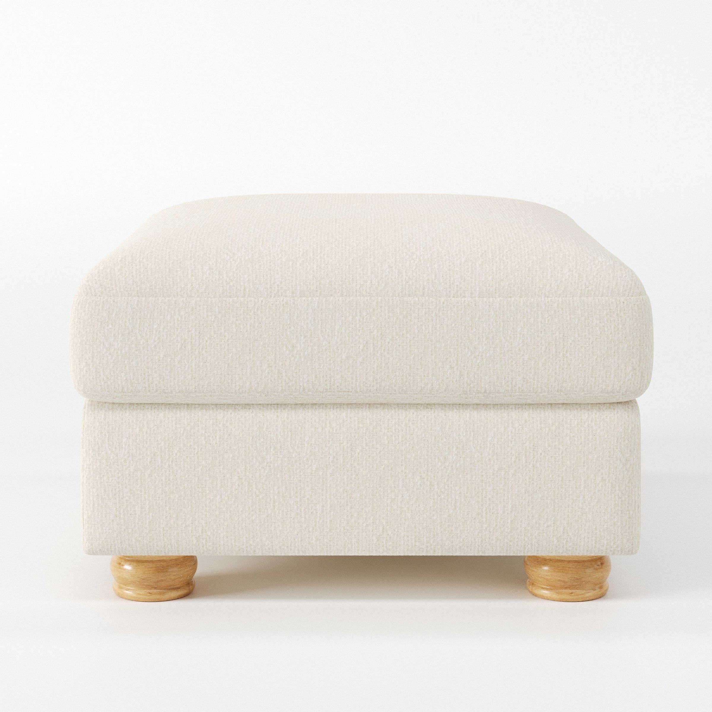 Anna Lee footstool in Kilda Boucle Cream shown front-on against a neutral studio backdrop.
