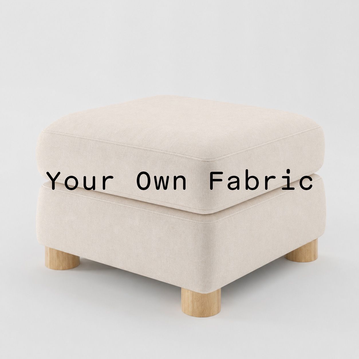Diagonal view of the Windermere footstool upholstered in customers own material calico cotton fabric.