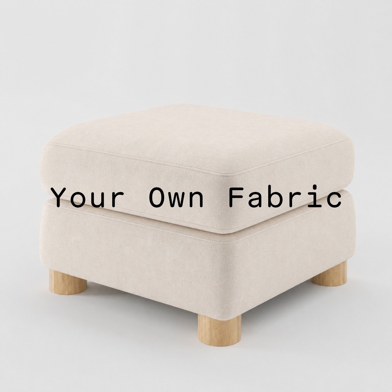 Diagonal view of the Windermere footstool upholstered in customers own material calico cotton fabric.