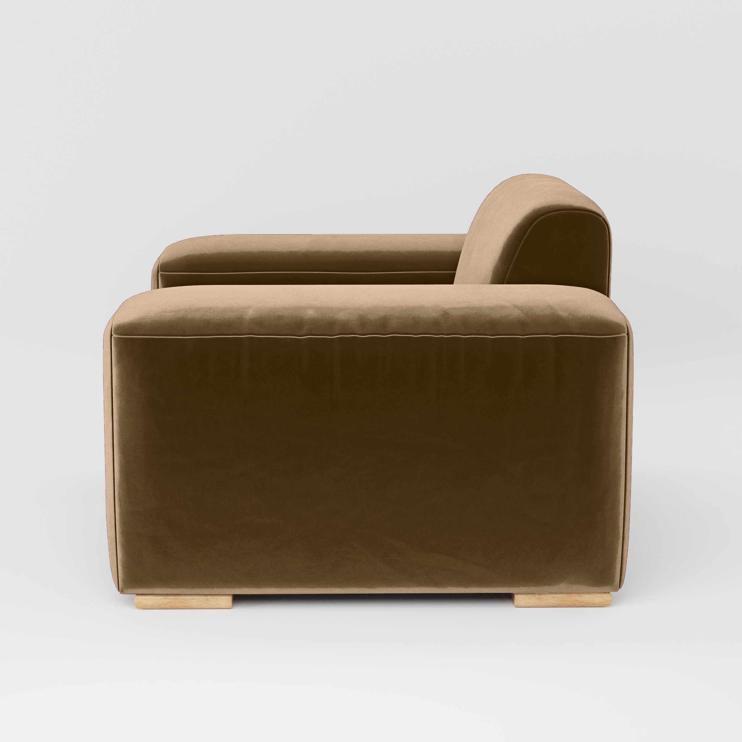 Side view of the Darwell armchair upholstered in Plush EasyClean Velvet in Caribou.