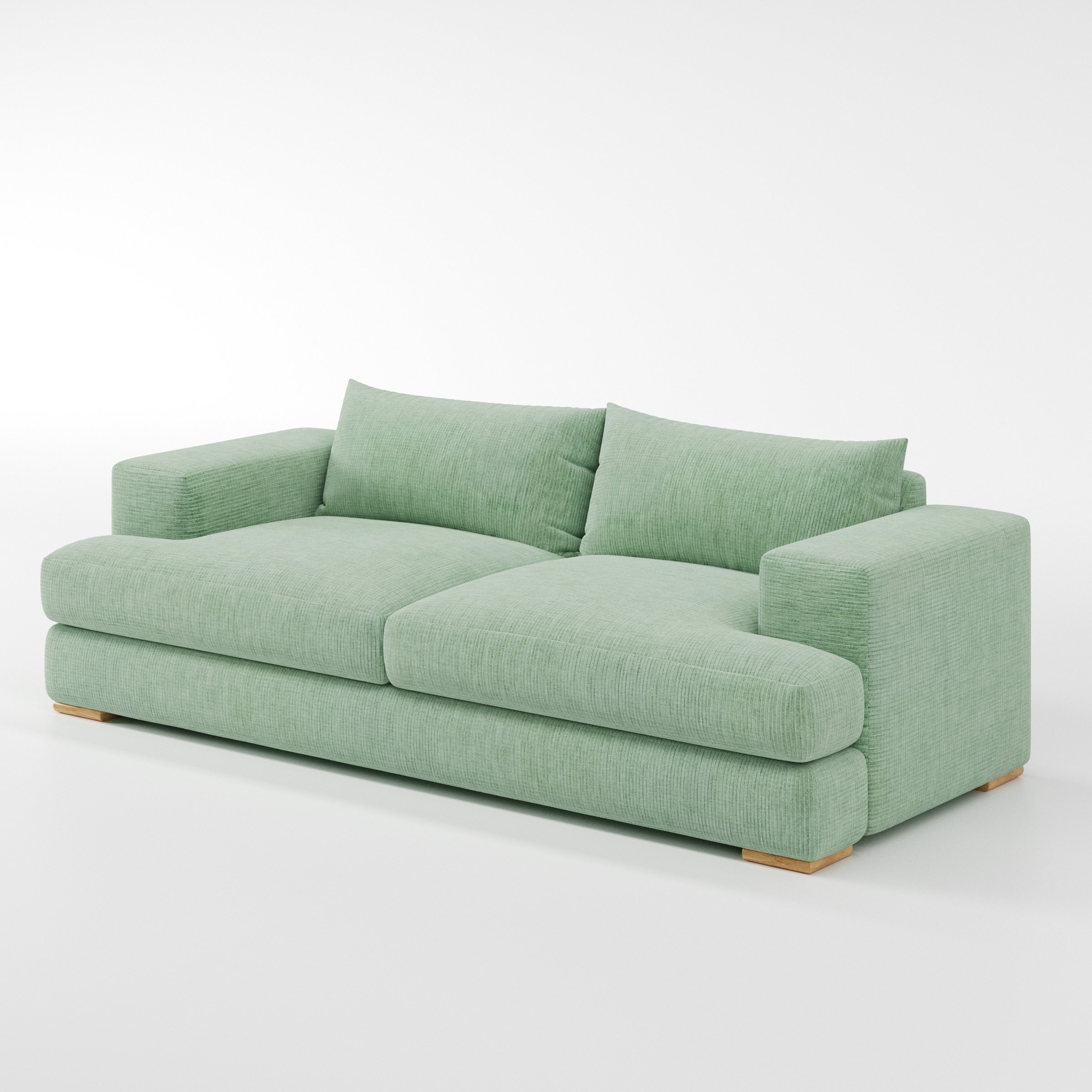 Fane sofa in Caldey Velvet Corduroy Eucalyptus shown at a diagonal angle highlighting arm profile and seat depth.
