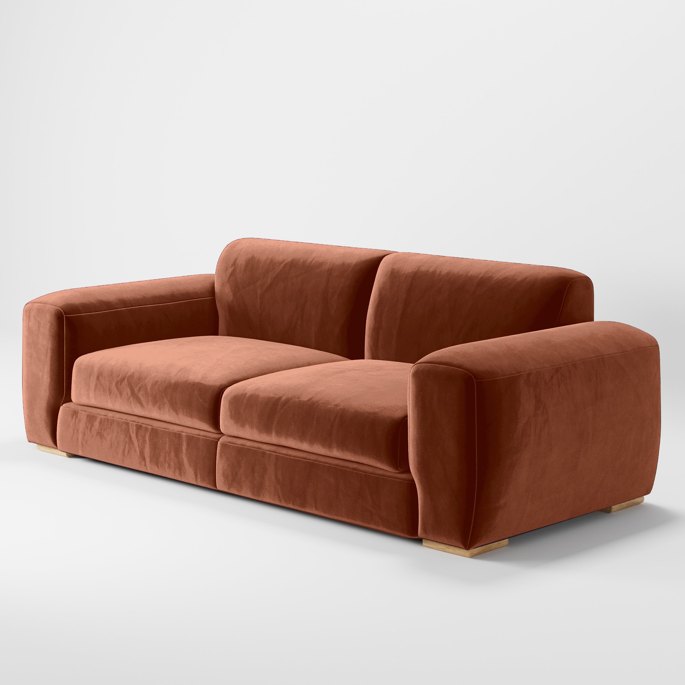 Diagonal view of the Darwell sofa upholstered in Plush EasyClean Velvet in Apricot.