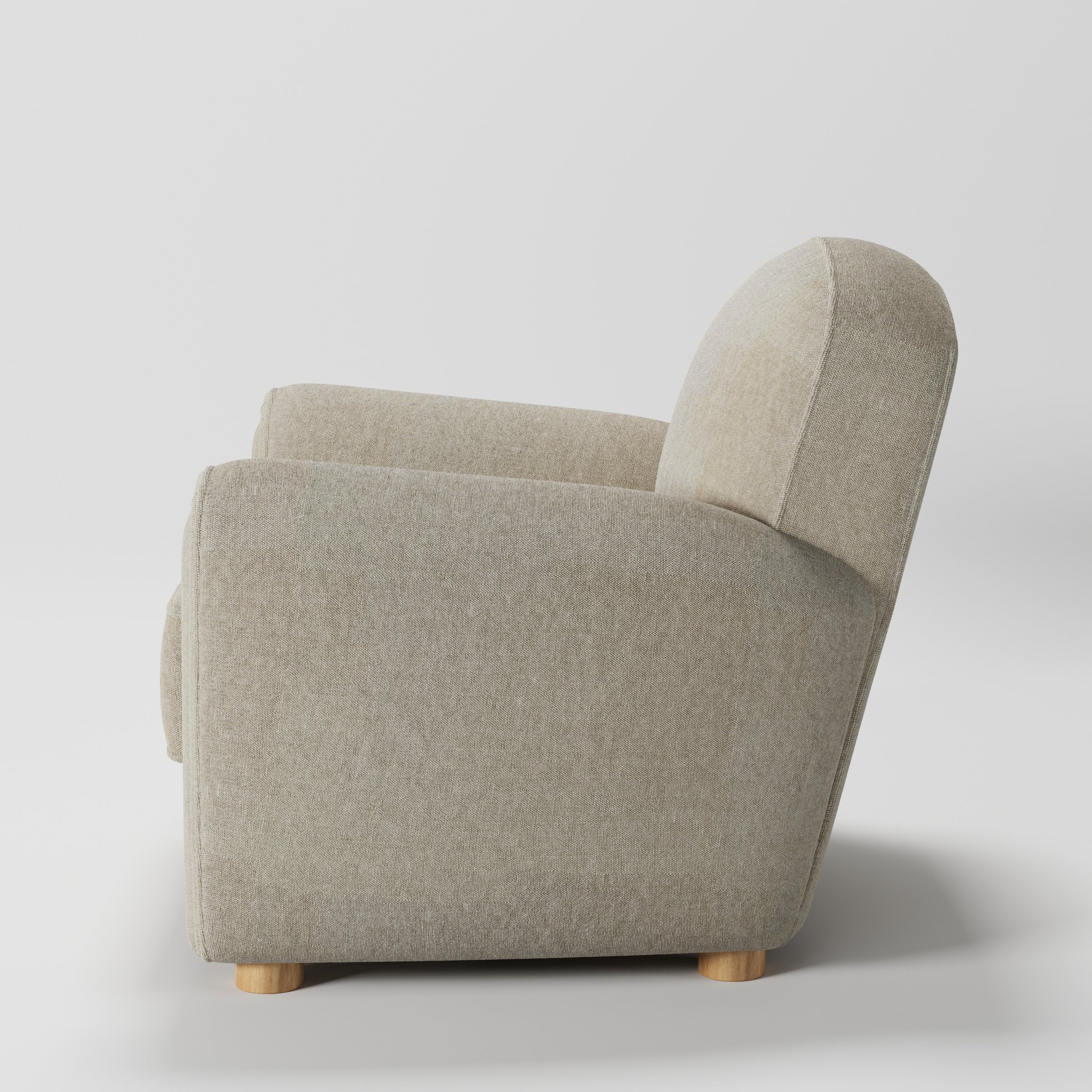 Fergus armchair in Alderney Linen Oatmeal shown in side profile displaying proportions and overall silhouette.