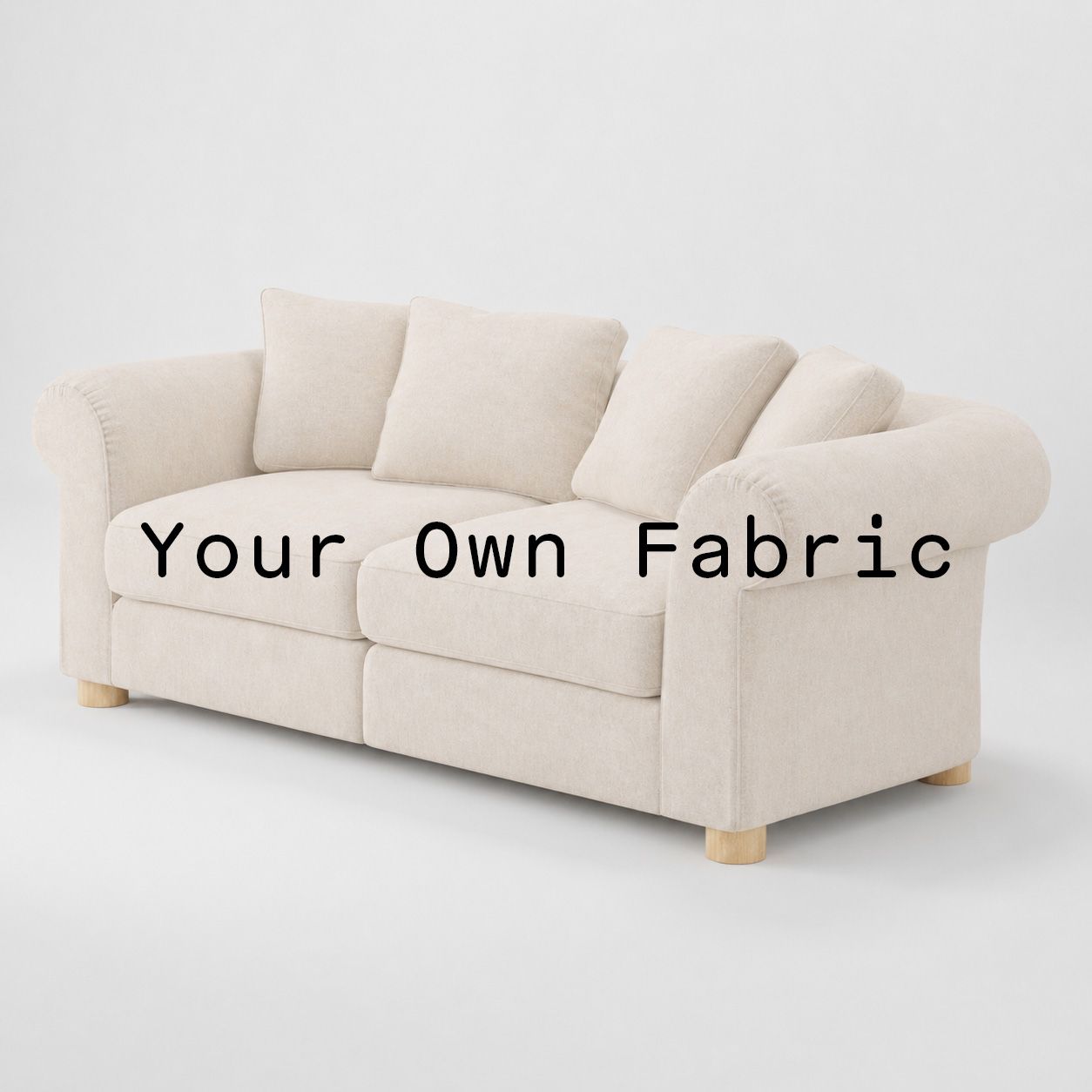 Diagonal view of the Windermere sofa upholstered in customers own material calico cotton fabric.