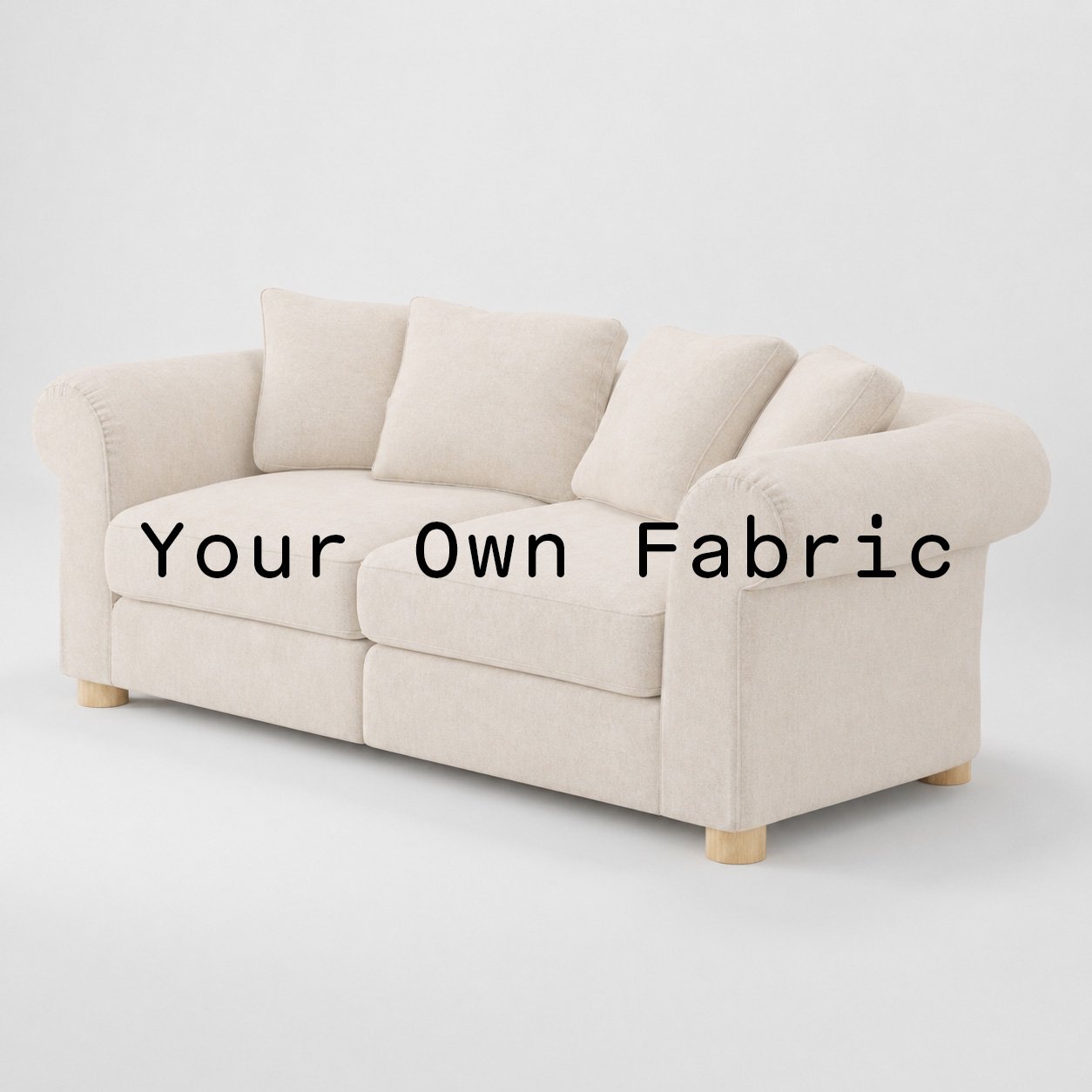 Diagonal view of the Windermere sofa upholstered in customers own material calico cotton fabric.
