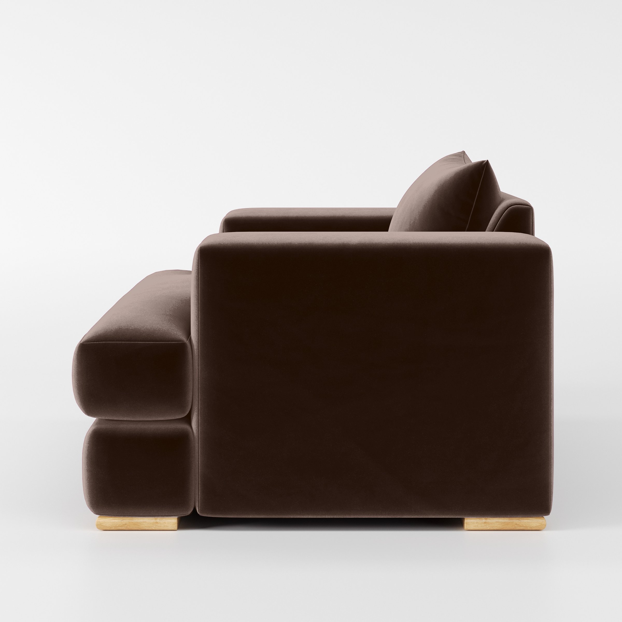 Side view of the Fane armchair upholstered in Plush EasyClean Velvet in Mole.