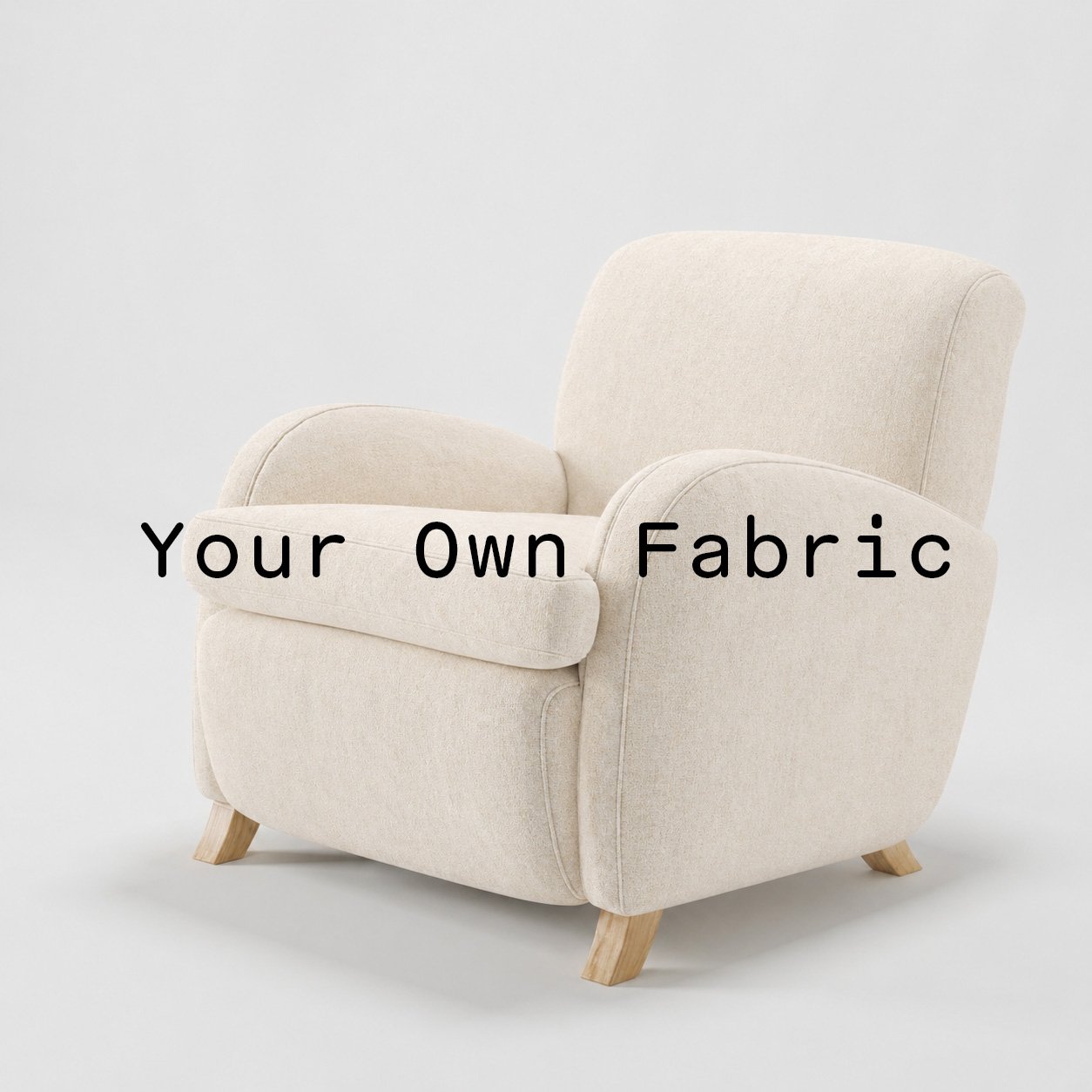 Diagonal view of the Rye armchair upholstered in customers own material calico cotton fabric.