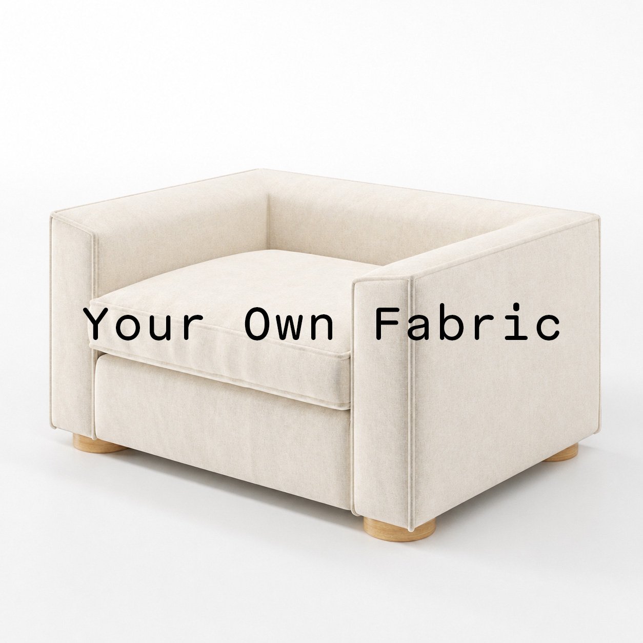 Diagonal view of the Feale armchair upholstered in customers own material calico cotton fabric.